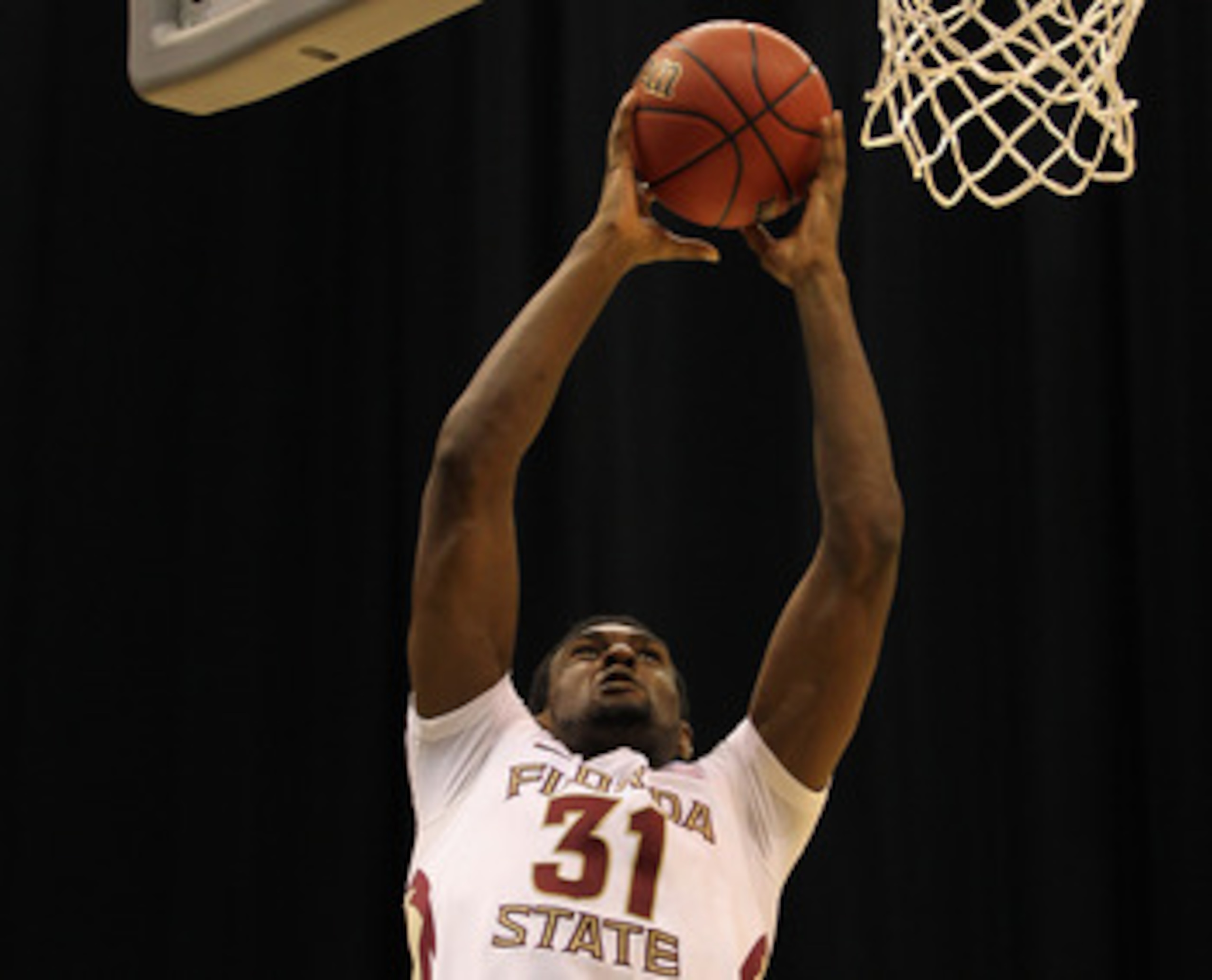 SAN ANTONIO, TX - MARCH 25:  Chris Singleton #31 of the Florida State Seminoles goes to the basket against Jamie Skeen #21 of the Virginia Commonwealth Rams during the southwest regional of the 2011 NCAA men's basketball tournament at the Alamodome on Mar