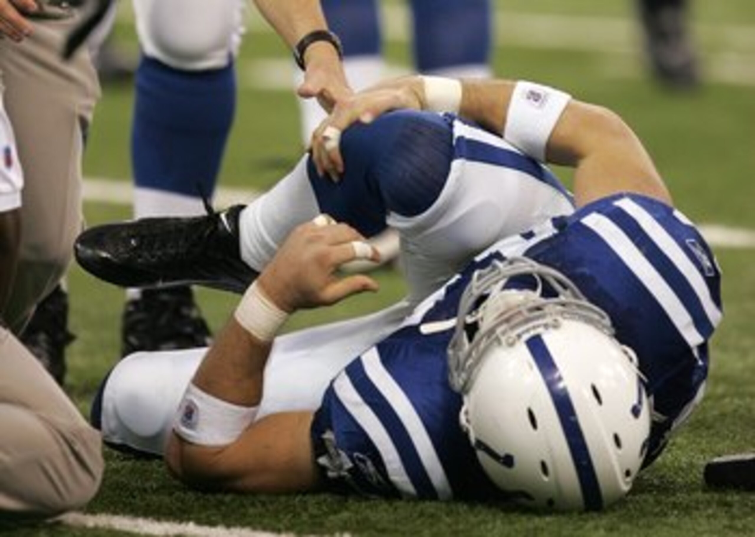 INDIANAPOLIS - NOVEMBER 26:  Tight end Dallas Clark #44 of the Indianapolis Colts grabs his injured right knee against the Philadelphia Eagles November 26, 2006 at the RCA Dome in Indianapolis, Indiana. The Colts won 45-21.  (Photo by Jonathan Daniel/Gett