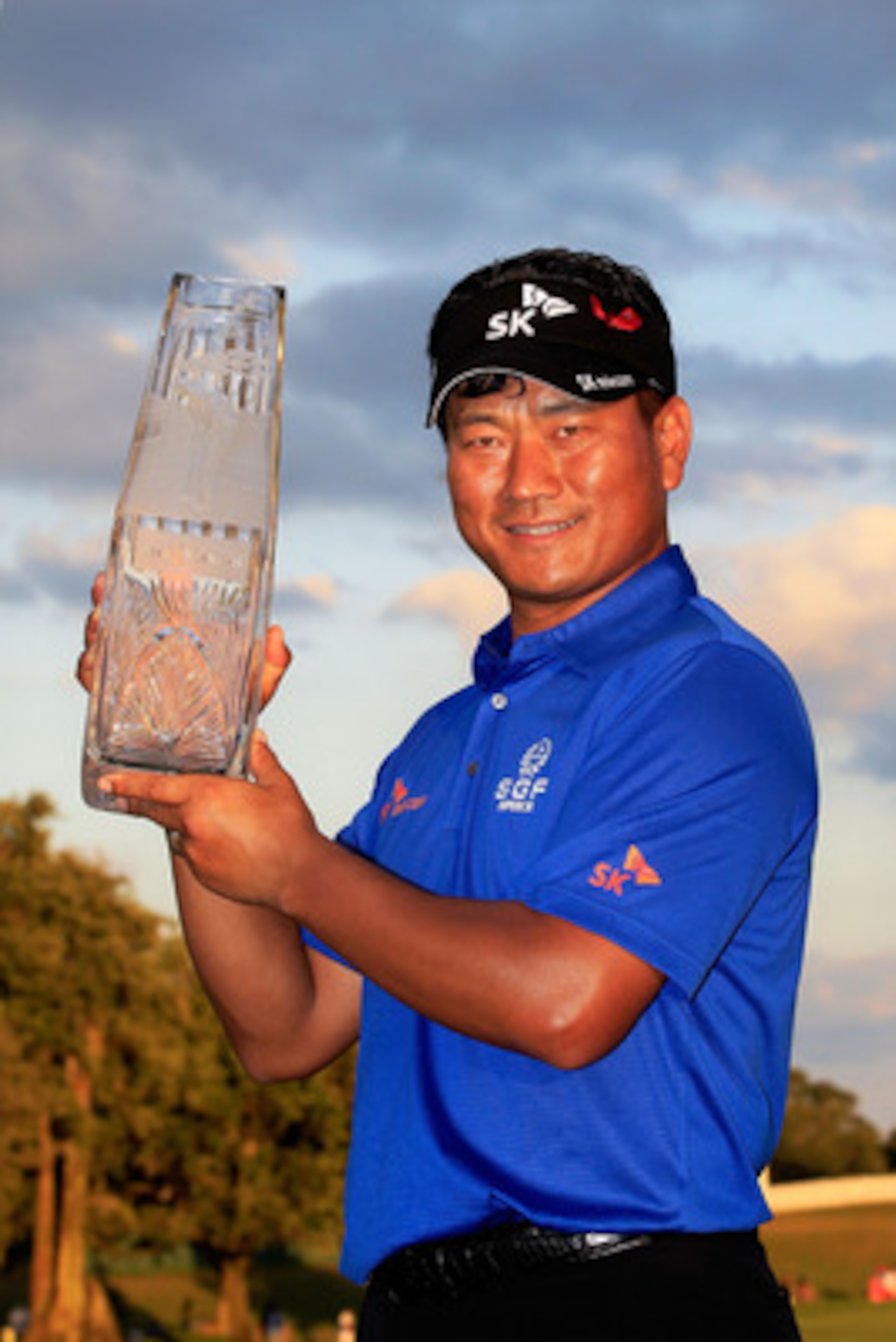 PONTE VEDRA BEACH, FL - MAY 15:  K.J. Choi of South Korea celebrates with the trophy after defeating David Toms on the first playoff hole to win THE PLAYERS Championship held at THE PLAYERS Stadium course at TPC Sawgrass on May 15, 2011 in Ponte Vedra Bea