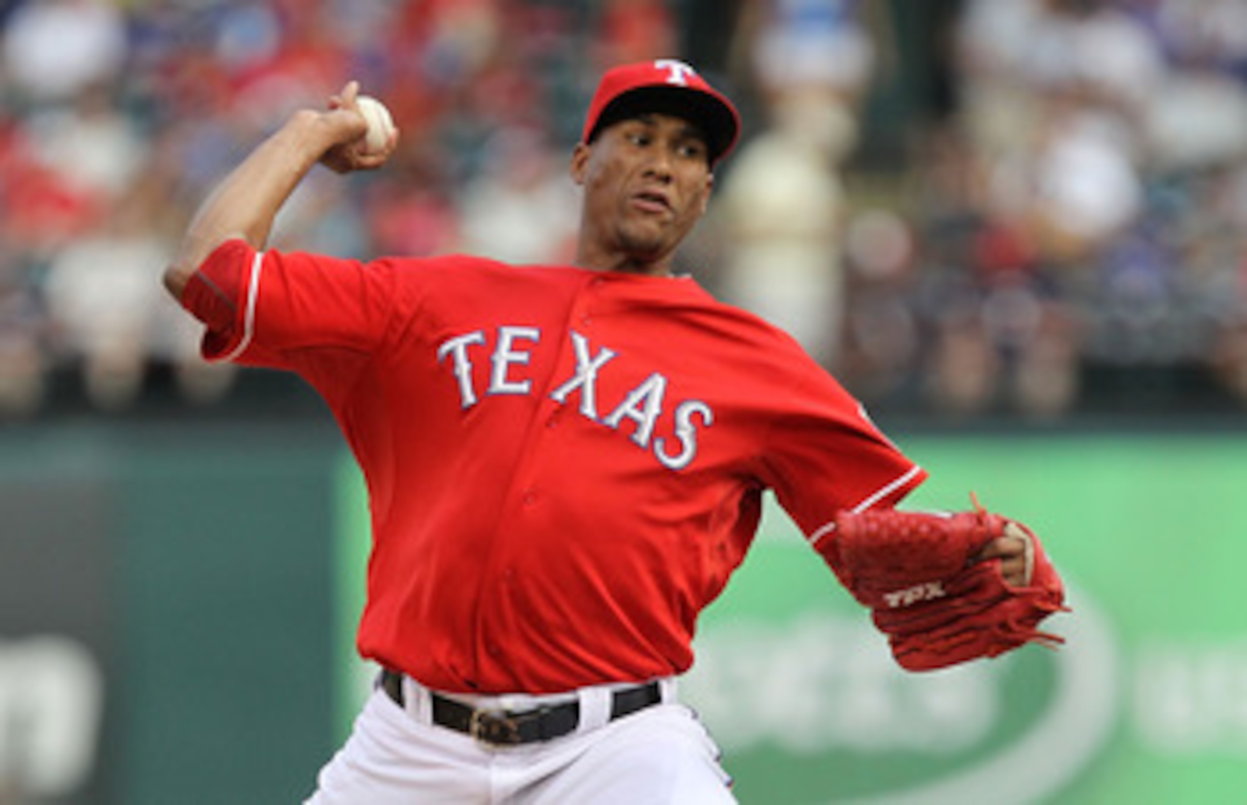 ARLINGTON, TX - JUNE 08:  Pitcher Alexi Ogando #41 of the Texas Rangers throws against the Detroit Tigers at Rangers Ballpark in Arlington on June 8, 2011 in Arlington, Texas.  (Photo by Ronald Martinez/Getty Images)
