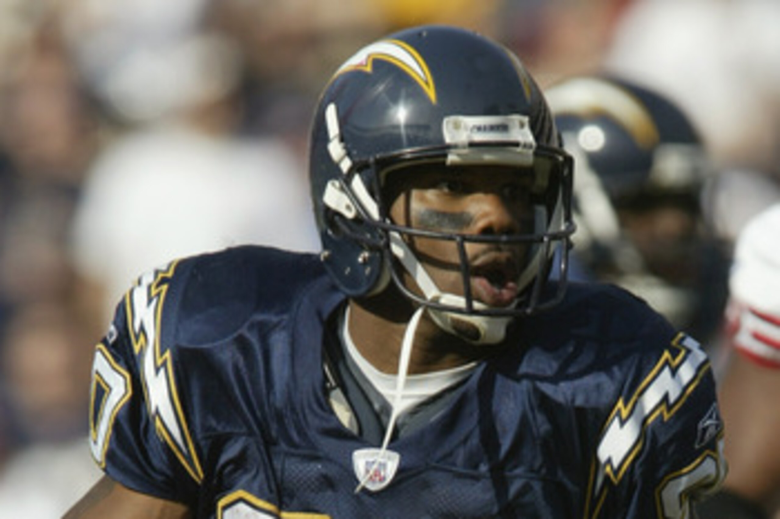 SAN DIEGO, CA - NOVEMBER 17:  Wide receiver Curtis Conway #80 of the San Diego Chargers runs with the ball during the NFL game against the San Francisco 49ers at Qualcomm Stadium on November 17, 2002 in San Diego, California. The Chargers won in overtime