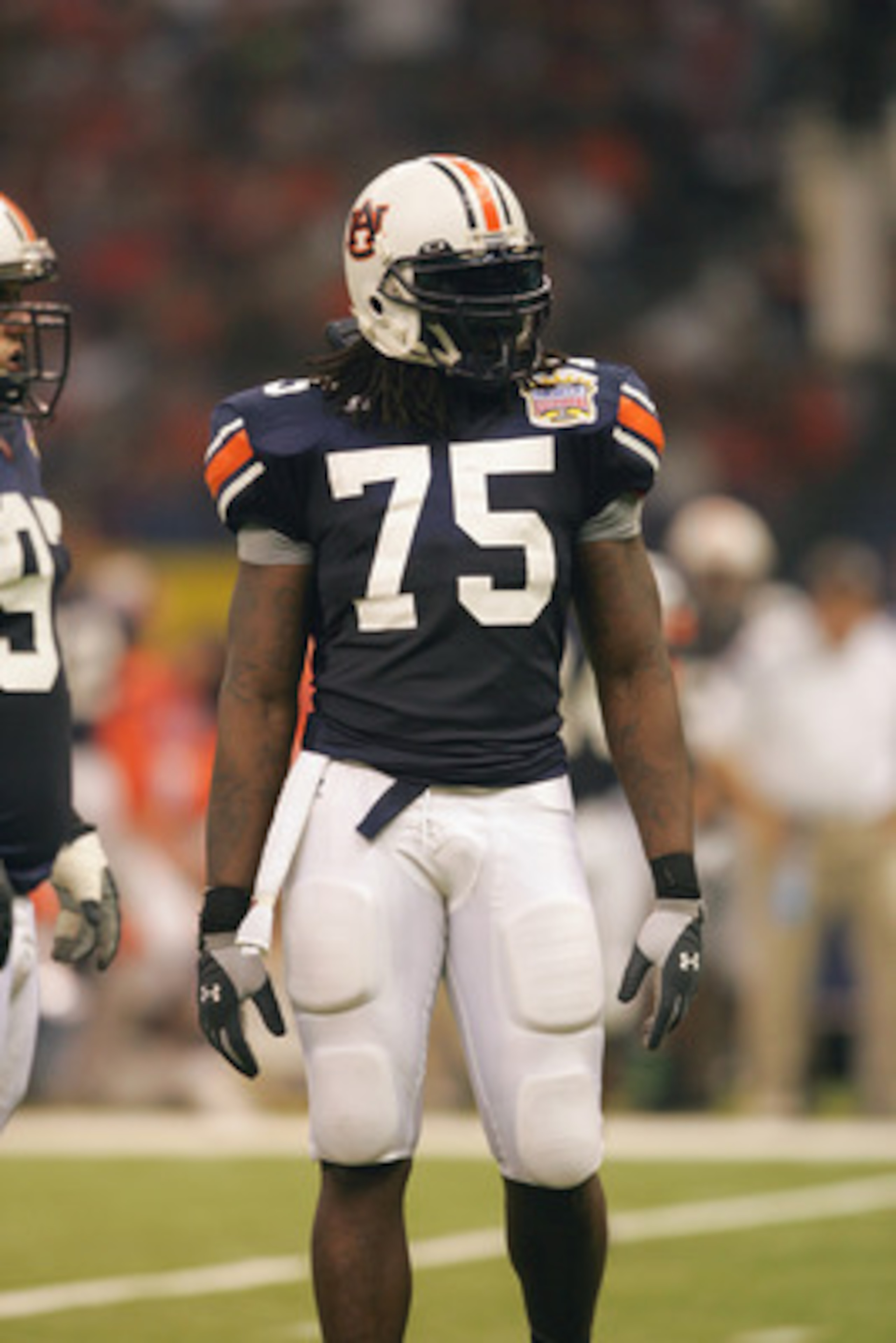 NEW ORLEANS - JANUARY 3:  Defensive end Stanley McClover #75 of the Auburn Tigers looks on against the Virginia Tech Hokies during the Nokia Sugar Bowl on January 3, 2005 at the Superdome in New Orleans, Louisiana.  The No. 3 Tigers completed a perfect se