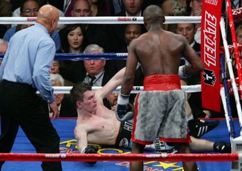 LAS VEGAS - DECEMBER 08:  Ricky Hatton is knocked down in the 10th round by Floyd Mayweather Jr. as referee Joe Cortez (L) moves in during their WBC world welterweight championship fight at the MGM Grand Garden Arena on December 8, 2007 in Las Vegas, Neva