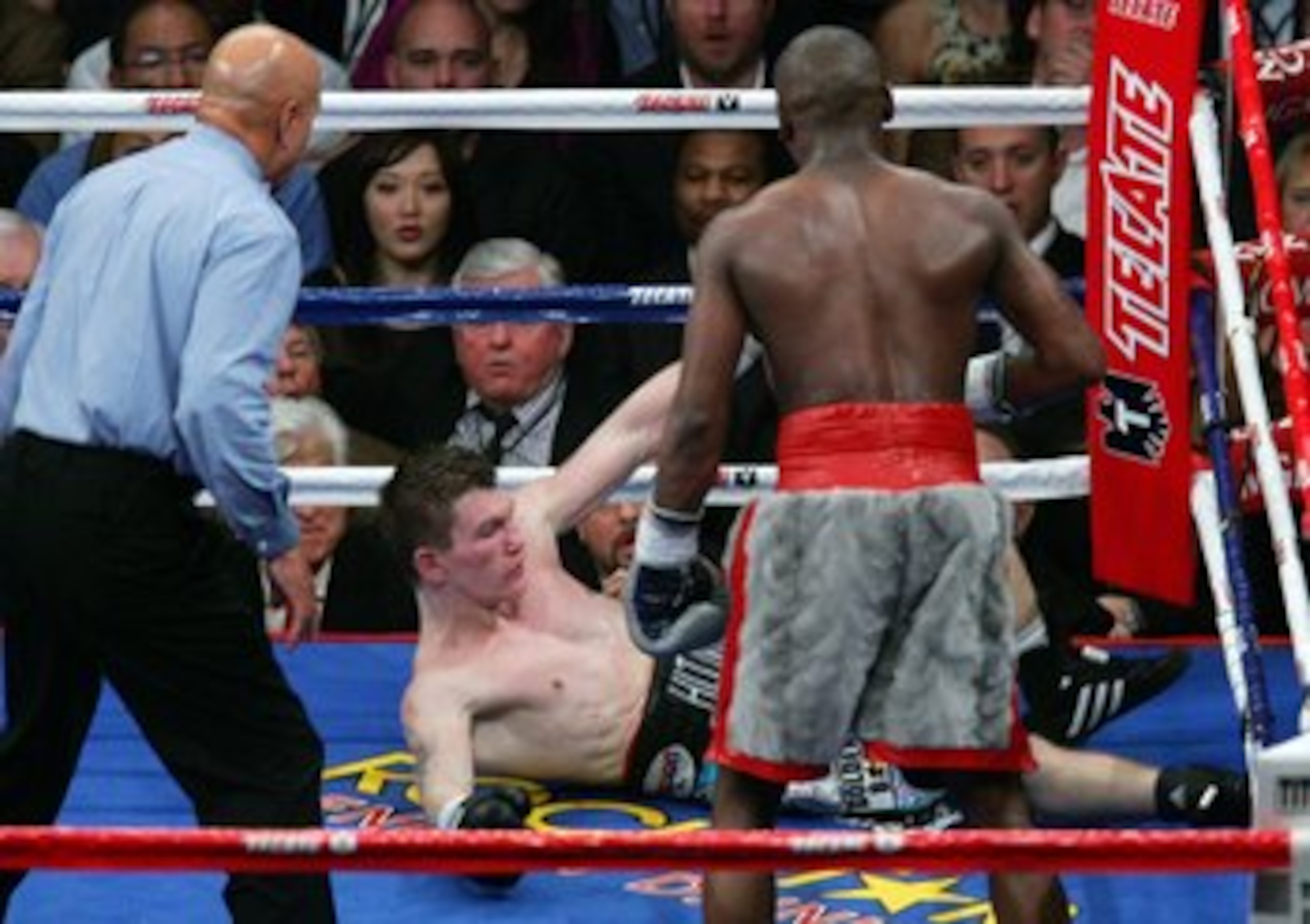 LAS VEGAS - DECEMBER 08:  Ricky Hatton is knocked down in the 10th round by Floyd Mayweather Jr. as referee Joe Cortez (L) moves in during their WBC world welterweight championship fight at the MGM Grand Garden Arena on December 8, 2007 in Las Vegas, Neva