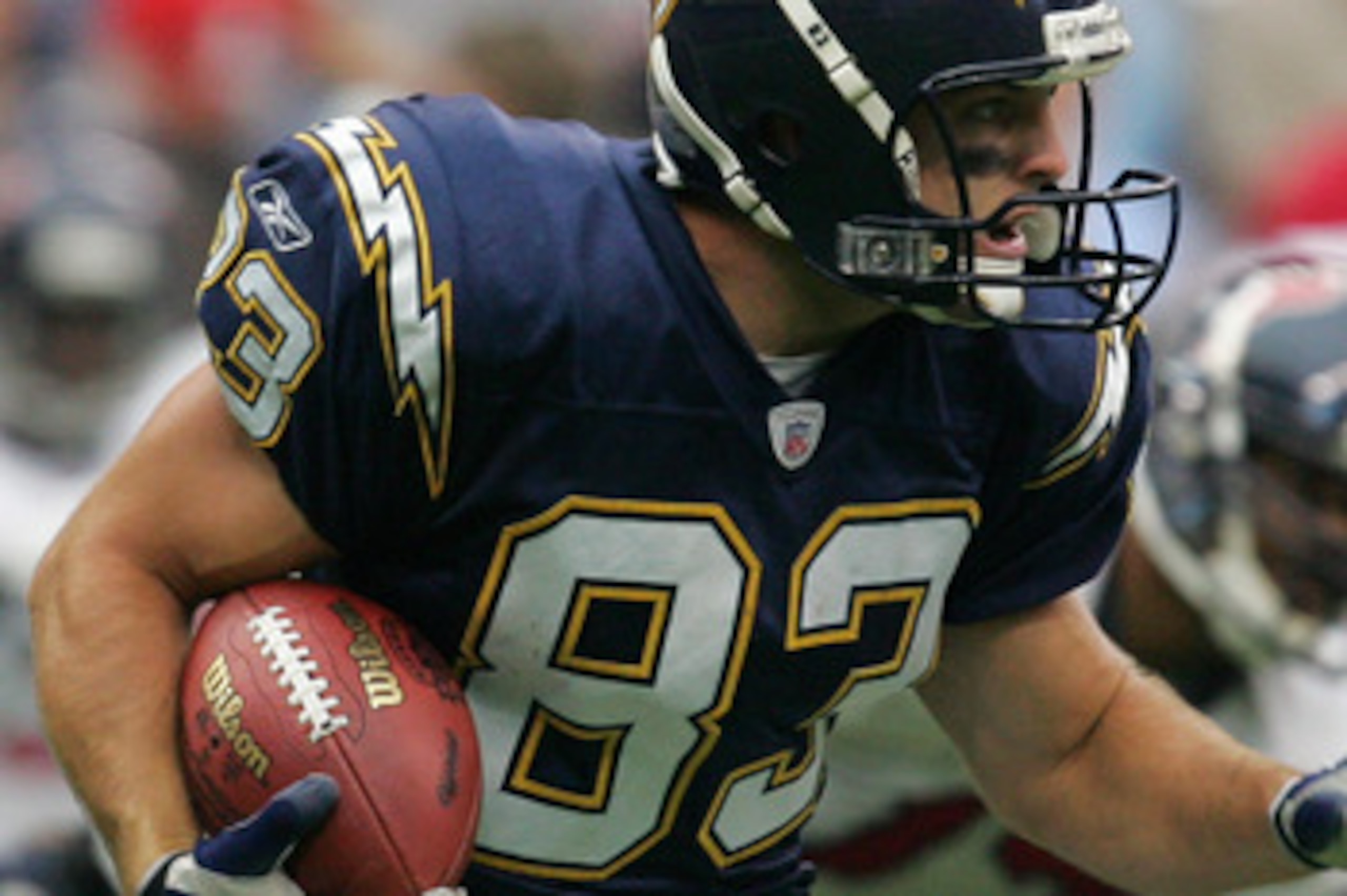 HOUSTON - SEPTEMBER 12:  Wes Welker #83 of the San Diego Chargers carries the ball during the game against the Houston Texans on September 12, 2004 at Reliant Stadium in Houston, Texas. The Chargers won 27-20.  (Photo by Ronald Martinez/Getty Images)