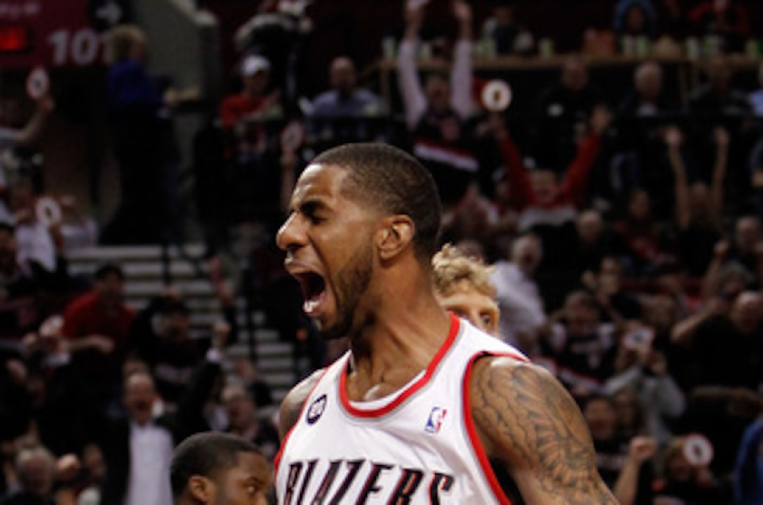 PORTLAND, OR - APRIL 21:  LaMarcus Aldridge #12 of the Portland Trail Blazers celebrates a dunk against the Dallas Mavericks in Game Three of the Western Conference Quarterfinals in the 2011 NBA Playoffs on April 21, 2011 at the Rose Garden in Portland, O