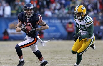 CHICAGO, IL - JANUARY 23:  Johnny Knox #13 of the Chicago Bears runs ahead of Tramon Williams #38 of the Green Bay Packers for a 32-yard gain in the fourth quarter in the NFC Championship Game at Soldier Field on January 23, 2011 in Chicago, Illinois.  (P
