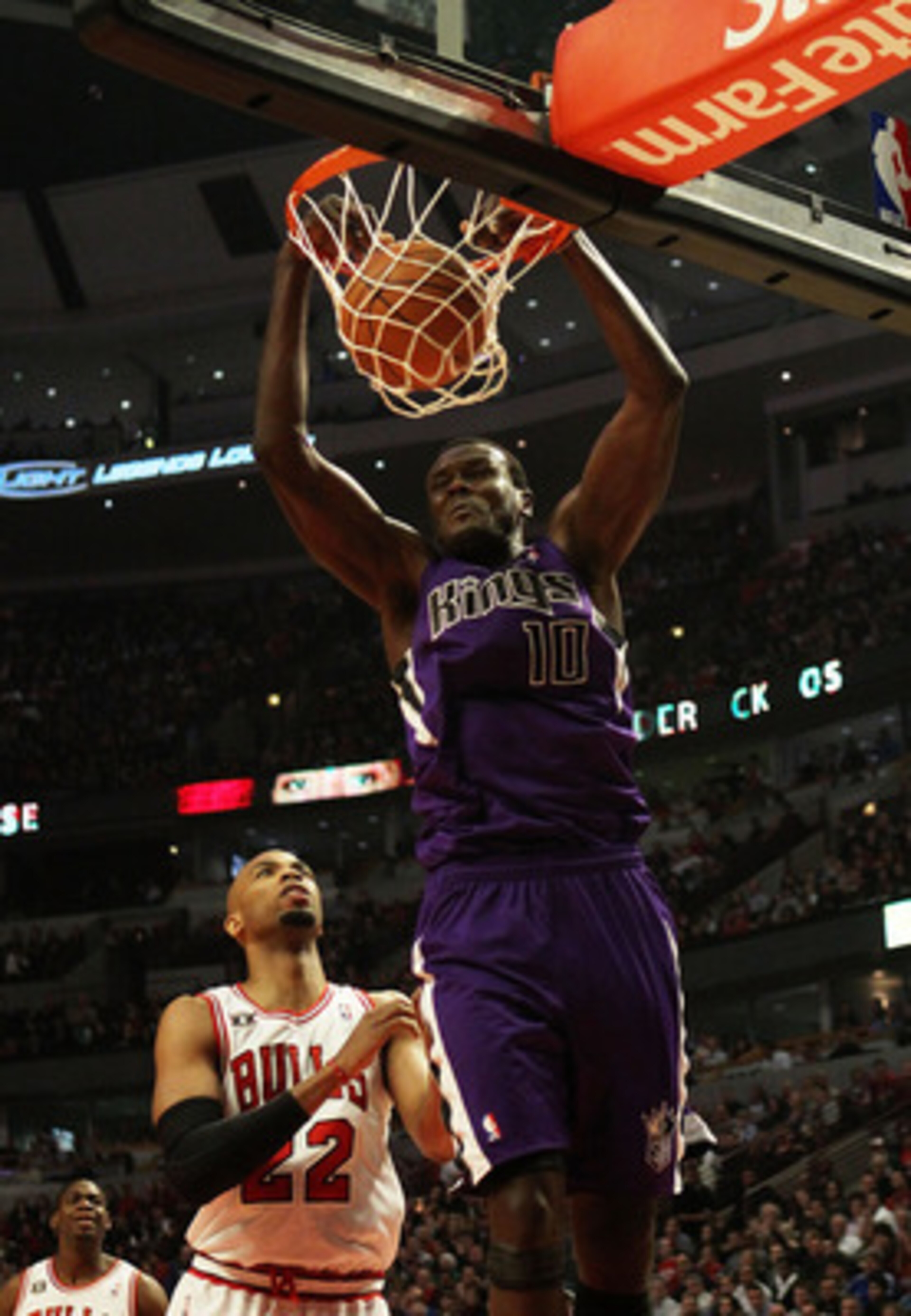 CHICAGO, IL - MARCH 21: Samuel Dalembert #10 of the Sacramento Kings dunks the ball over Taj Gibson #22 of the Chicago Bulls at the United Center on March 21, 2011 in Chicago, Illinois. The Bulls defeated the Kings 132-92. NOTE TO USER: User expressly ack CHICAGO, IL - MARCH 21: Samuel Dalembert #10 of the Sacramento Kings dunks the ball over Taj Gibson #22 of the Chicago Bulls at the United Center on March 21, 2011 in Chicago, Illinois. The Bulls defeated the Kings 132-92. NOTE TO USER: User expressly ack