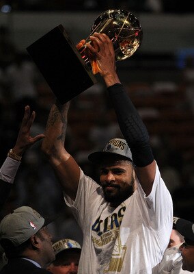 MIAMI, FL - JUNE 12:  Tyson Chandler #6 of the Dallas Mavericks celebrates with the Larry O'Brien trophy after the Mavericks won 105-95 against the Miami Heat in Game Six of the 2011 NBA Finals at American Airlines Arena on June 12, 2011 in Miami, Florida