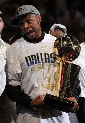 MIAMI, FL - JUNE 12:  Caron Butler of the Dallas Mavericks celebrates with the Larry O'Brien trophy after the Mavericks won 105-95 against the Miami Heat in Game Six of the 2011 NBA Finals at American Airlines Arena on June 12, 2011 in Miami, Florida. NOT