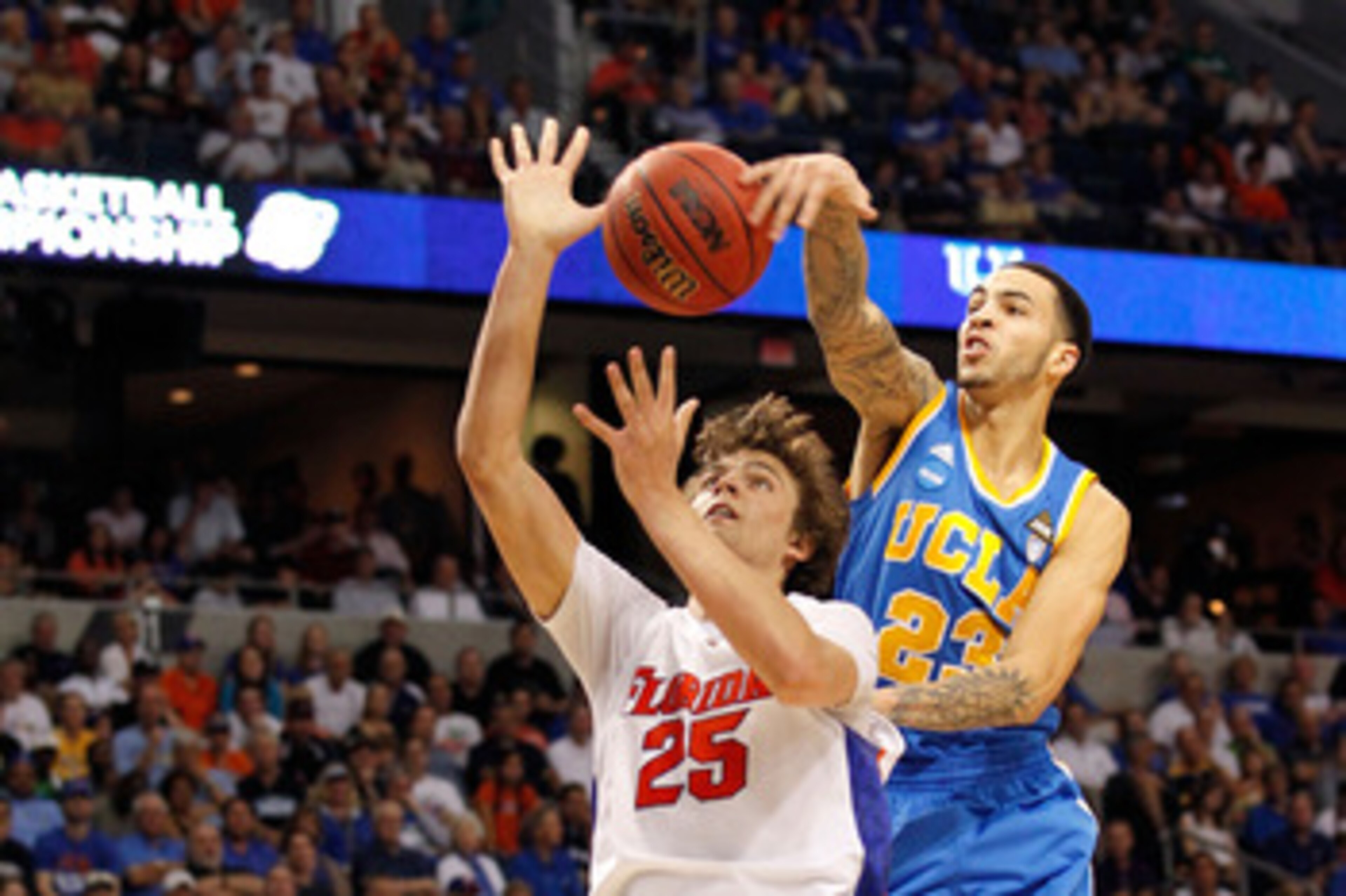 TAMPA, FL - MARCH 19:  Tyler Honeycutt #23 of the UCLA Bruins blocks a shot attempt by Chandler Parsons #25 of the Florida Gators during the third round of the 2011 NCAA men's basketball tournament at St. Pete Times Forum on March 19, 2011 in Tampa, Flori