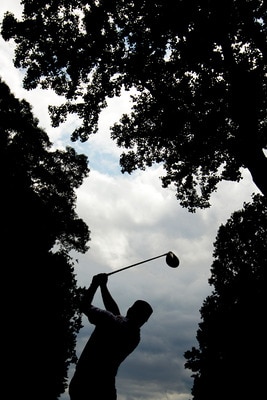 BETHESDA, MD - JUNE 14:  Graeme McDowell of Northern Ireland hits a shot during a practice round prior to the start of the 111th U.S. Open at Congressional Country Club on June 14, 2011 in Bethesda, Maryland.  (Photo by Ross Kinnaird/Getty Images)