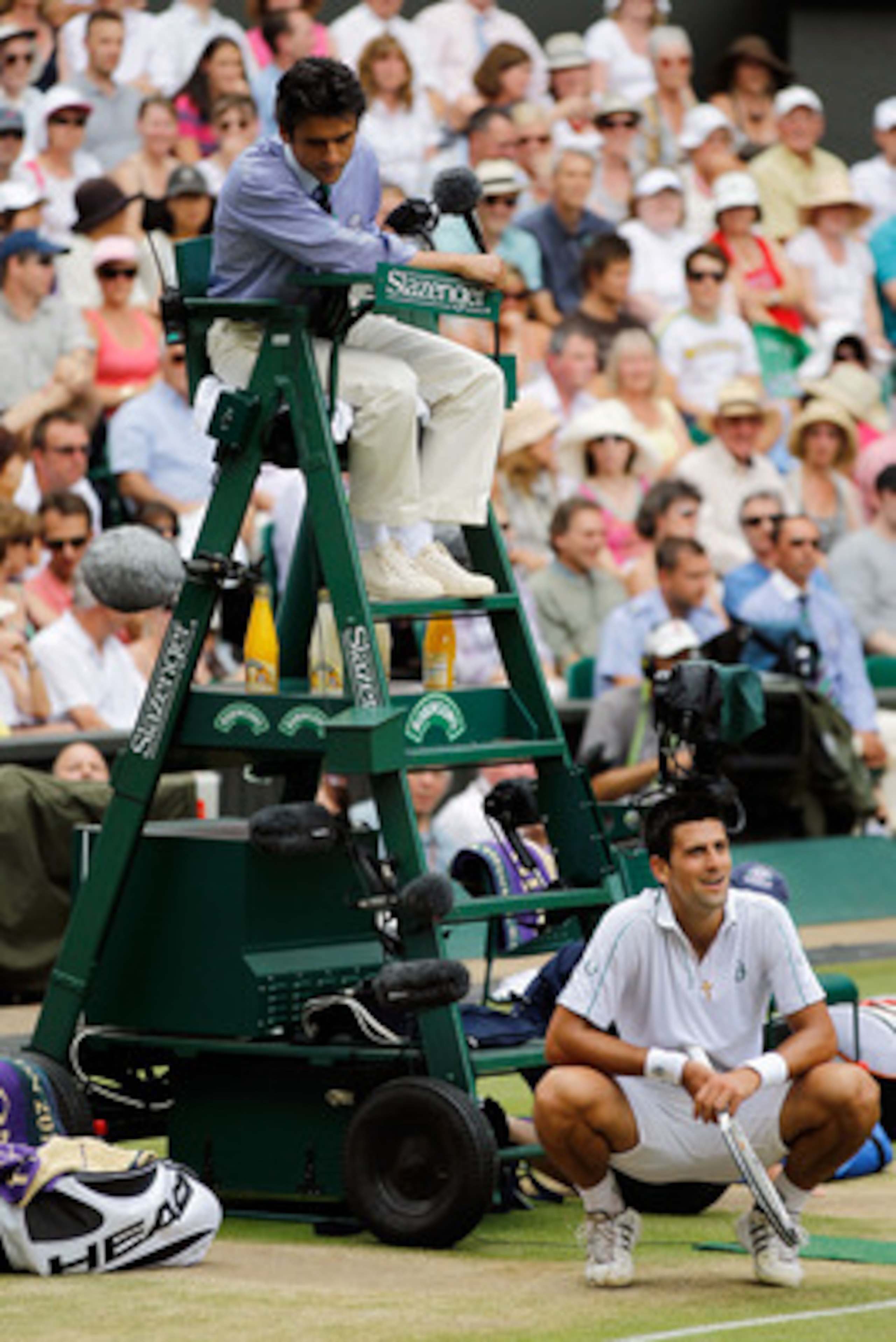 LONDON, ENGLAND - JULY 02:  Novak Djokovic of Serbia reacts as he speaks to the Chair Umpire after a line call during the Menï¿½s Semi Final match against Tomas Berdych of Czech Republic on Day Eleven of the Wimbledon Lawn Tennis Championships at the All En