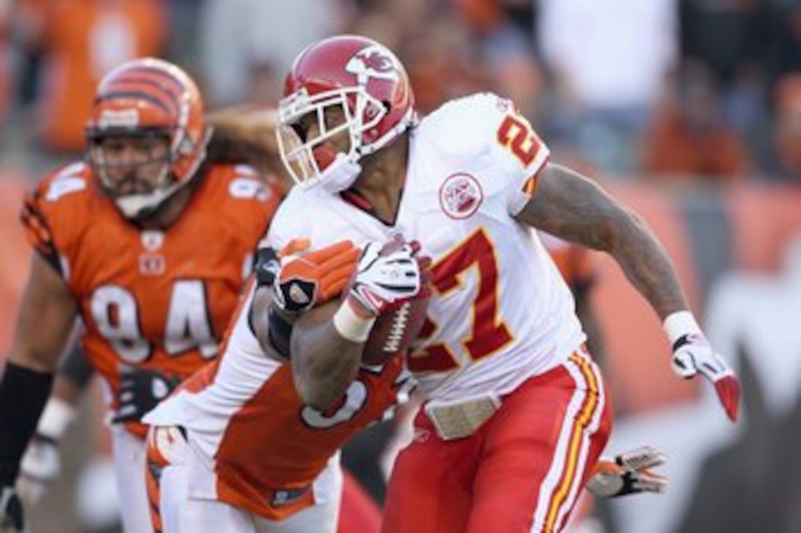 CINCINNATI - DECEMBER 28: Larry Johnson #27 of the Kansas City Chiefscarries the ball as he breaks a tackle during the NFL game against the Cincinnati Bengals on December 28, 2008 at Paul Brown Stadium in Cincinnati, Ohio.  (Photo by Andy Lyons/Getty Imag