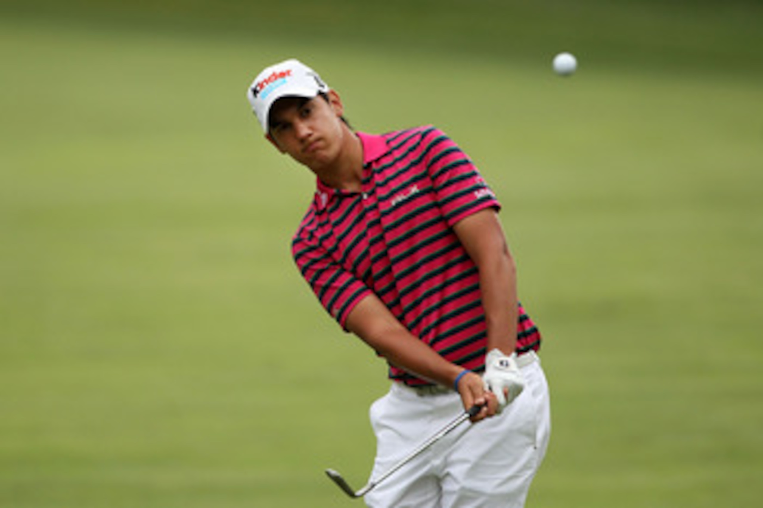 BETHESDA, MD - JUNE 14:  Matteo Manassero of Italy plays a pitch shot during a practice round prior to the start of the 111th U.S. Open at Congressional Country Club on June 14, 2011 in Bethesda, Maryland.  (Photo by Andrew Redington/Getty Images)