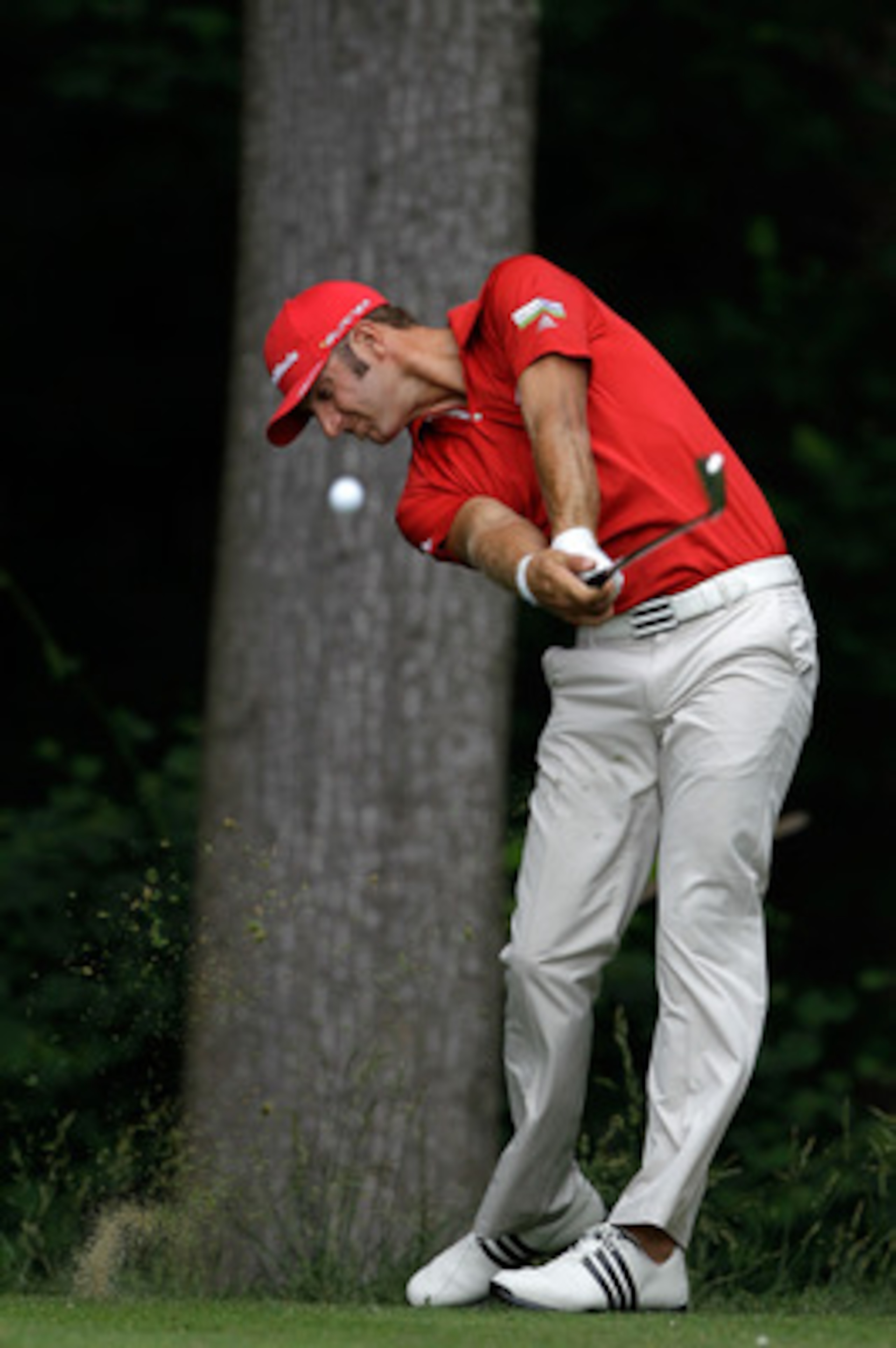 BETHESDA, MD - JUNE 14:  Dustin Johnson hits a shot during a practice round prior to the start of the 111th U.S. Open at Congressional Country Club on June 14, 2011 in Bethesda, Maryland.  (Photo by Rob Carr/Getty Images)