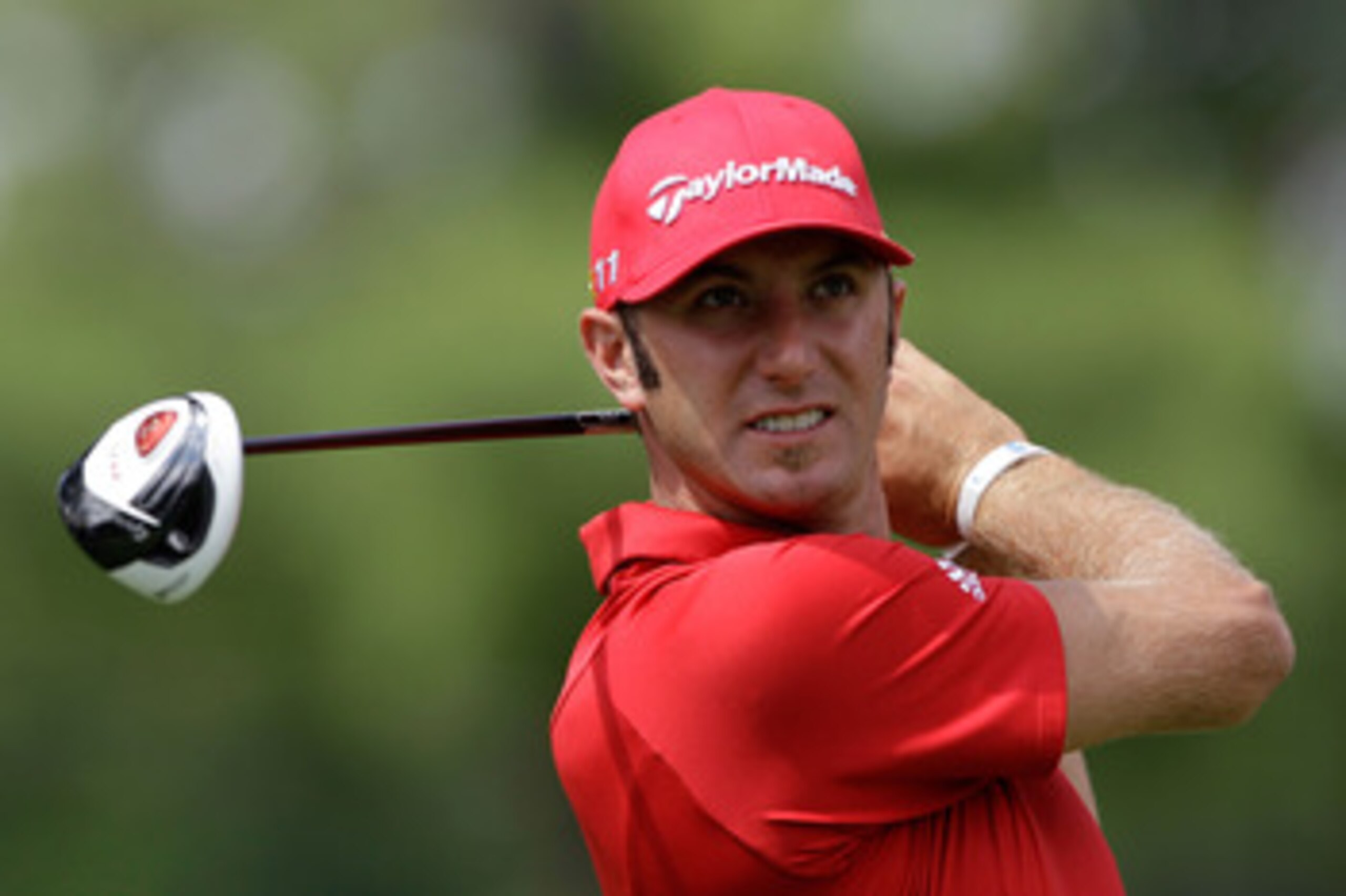 BETHESDA, MD - JUNE 14:   Dustin Johnson hits a shot during a practice round prior to the start of the 111th U.S. Open at Congressional Country Club on June 14, 2011 in Bethesda, Maryland.  (Photo by Rob Carr/Getty Images)