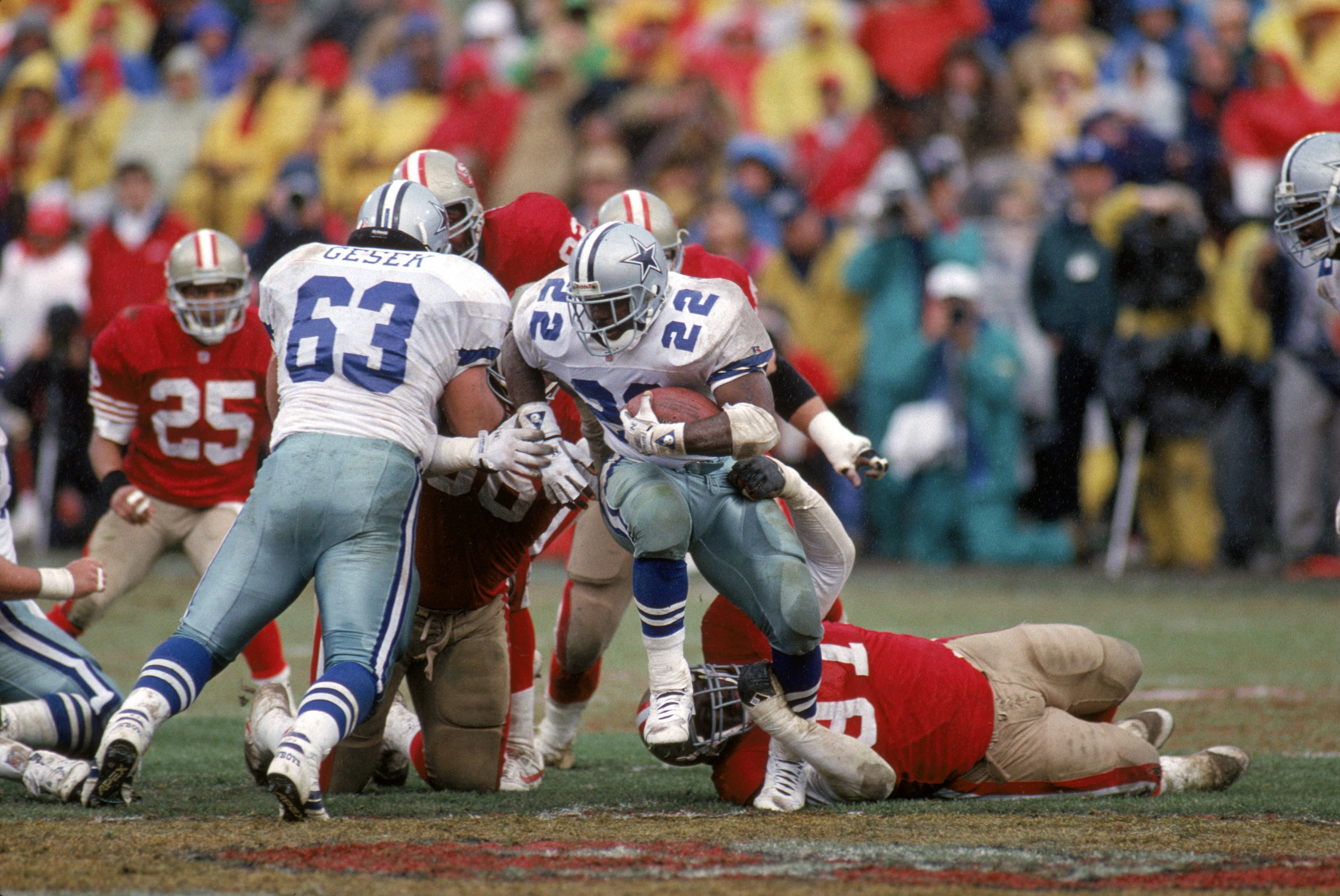 SAN FRANCISCO - JANUARY 17:  Running back Emmitt Smith #22 of the Dallas Cowboys hustles for yards during the 1992 NFC Conference Championship game against the San Francisco 49ers at Candlestick Park on January 17, 1993 in San Francisco, California.  The