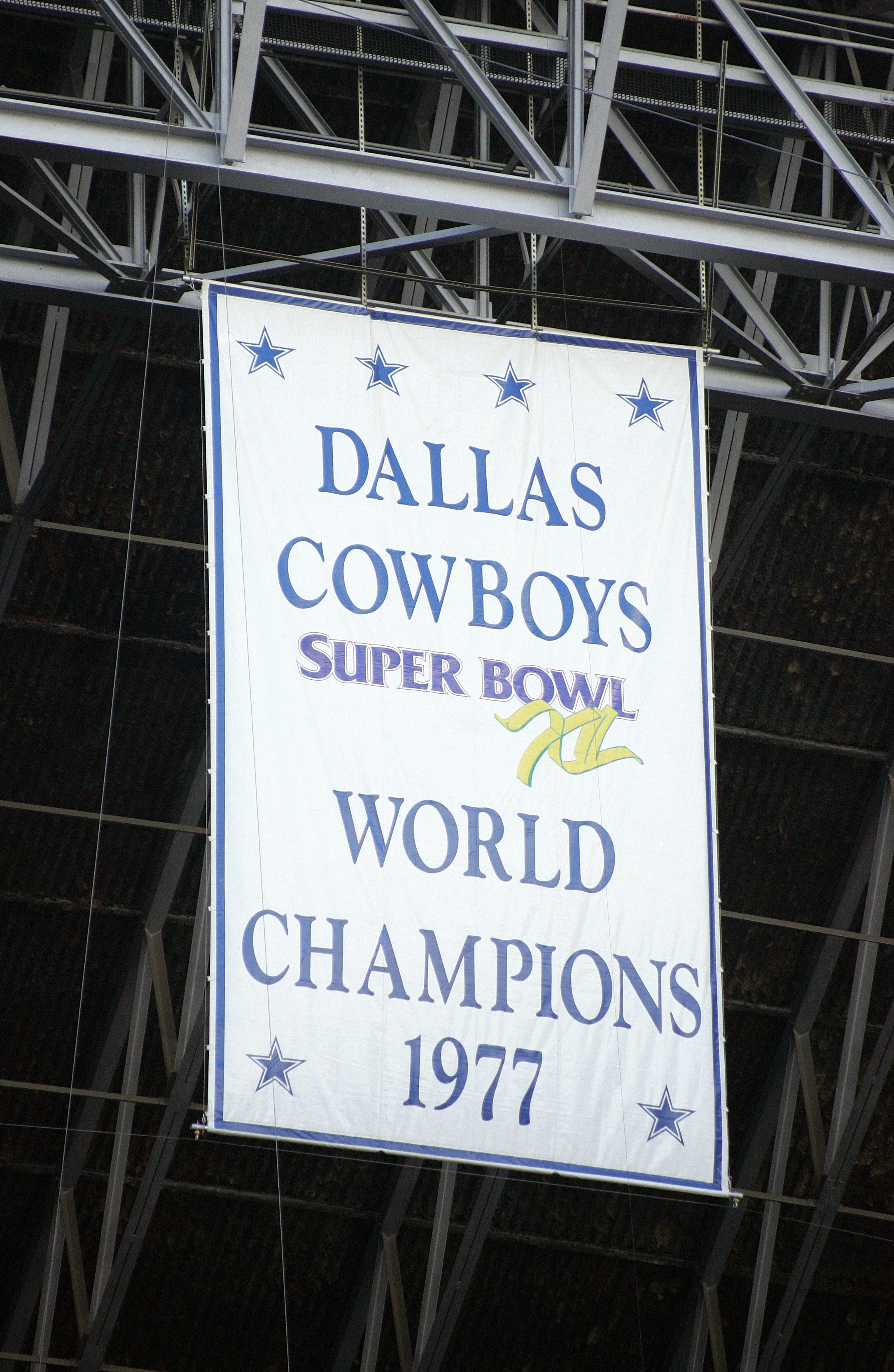 IRVING, TX - NOVEMBER 20:  A banner hangs from the rafters commemorating the 1977 Dallas Cowboys as Super Bowl XI Champions during the game between the Detroit Lions and the Dallas Cowboys on November 20, 2005 at Texas Stadium in Irving, Texas.  The Cowbo