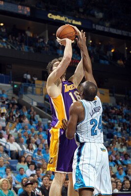 NEW ORLEANS, LA - APRIL 28:  Forward Pau Gasol #16 of the Los Angeles Lakers takes a shot against Carl Landry #24 of the New Orleans Hornets in Game Six of the Western Conference Quarterfinals in the 2011 NBA Playoffs on April 28, 2011 at New Orleans Aren