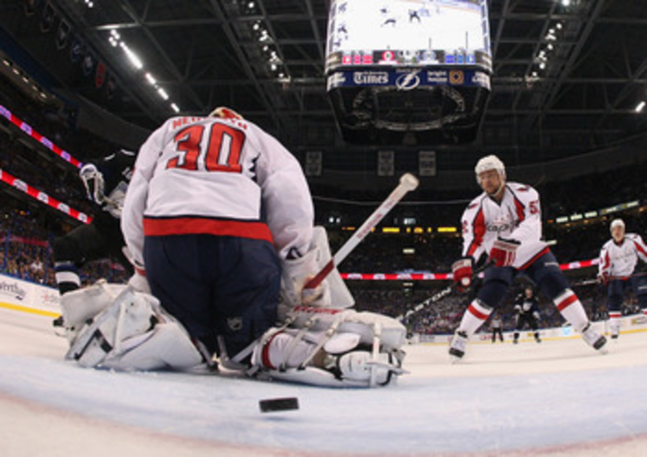 TAMPA, FL - MAY 03: A shot by Sean Bergenheim #10 of the Tampa Bay Lightning eludes Michal Neuvirth #30 of the Washington Capitals in Game Three of the Eastern Conference Semifinals during the 2011 NHL Stanley Cup Playoffs at St Pete Times Forum on May 3,