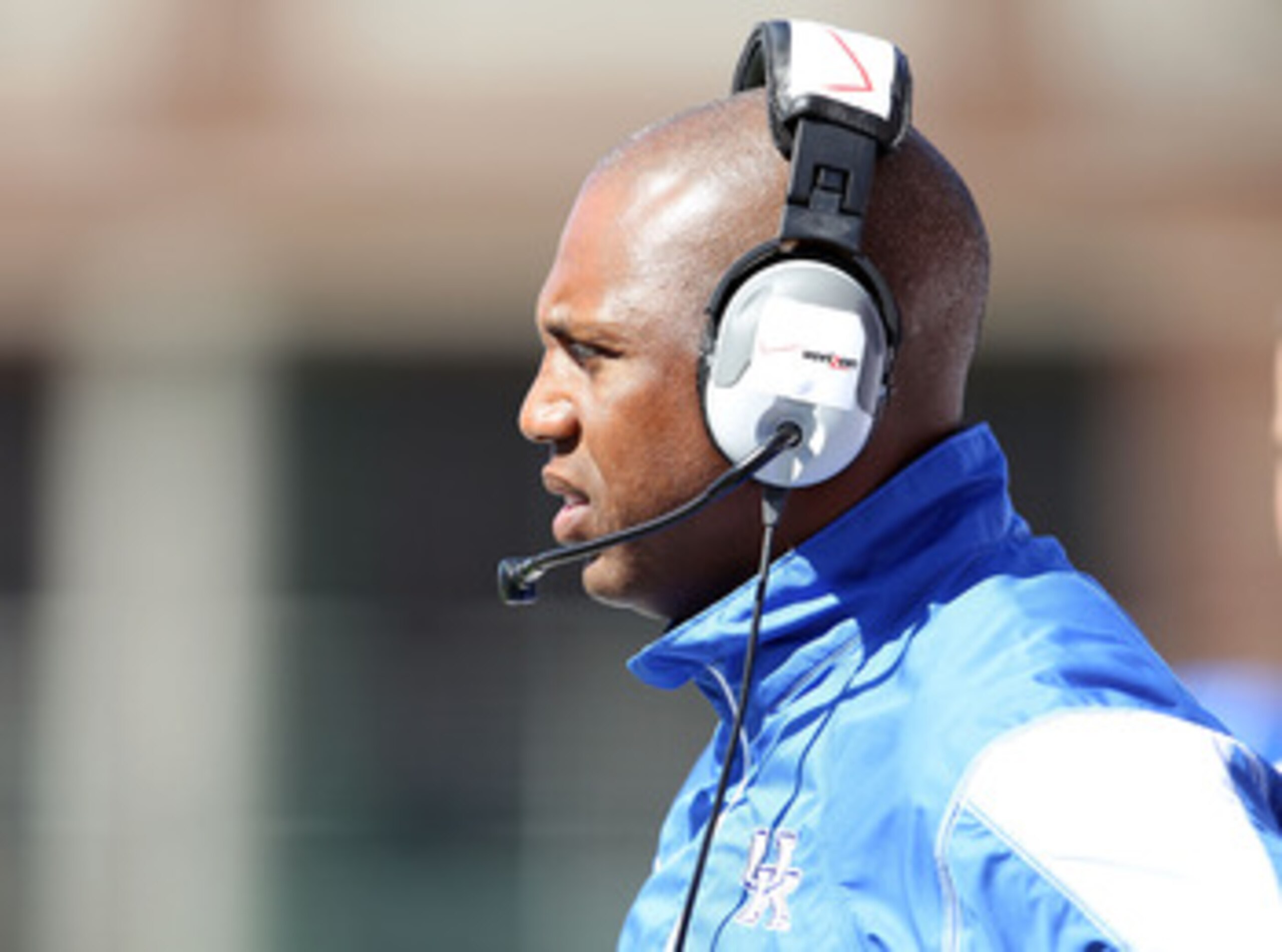 LOUISVILLE, KY - SEPTEMBER 04:  Joker Phillips the Head Coach of the Kentucky Wildcats gives instructions to his team during the game against the Louisville Cardinals at Papa John's Cardinal Stadium on September 4, 2010 in Louisville, Kentucky.  (Photo by