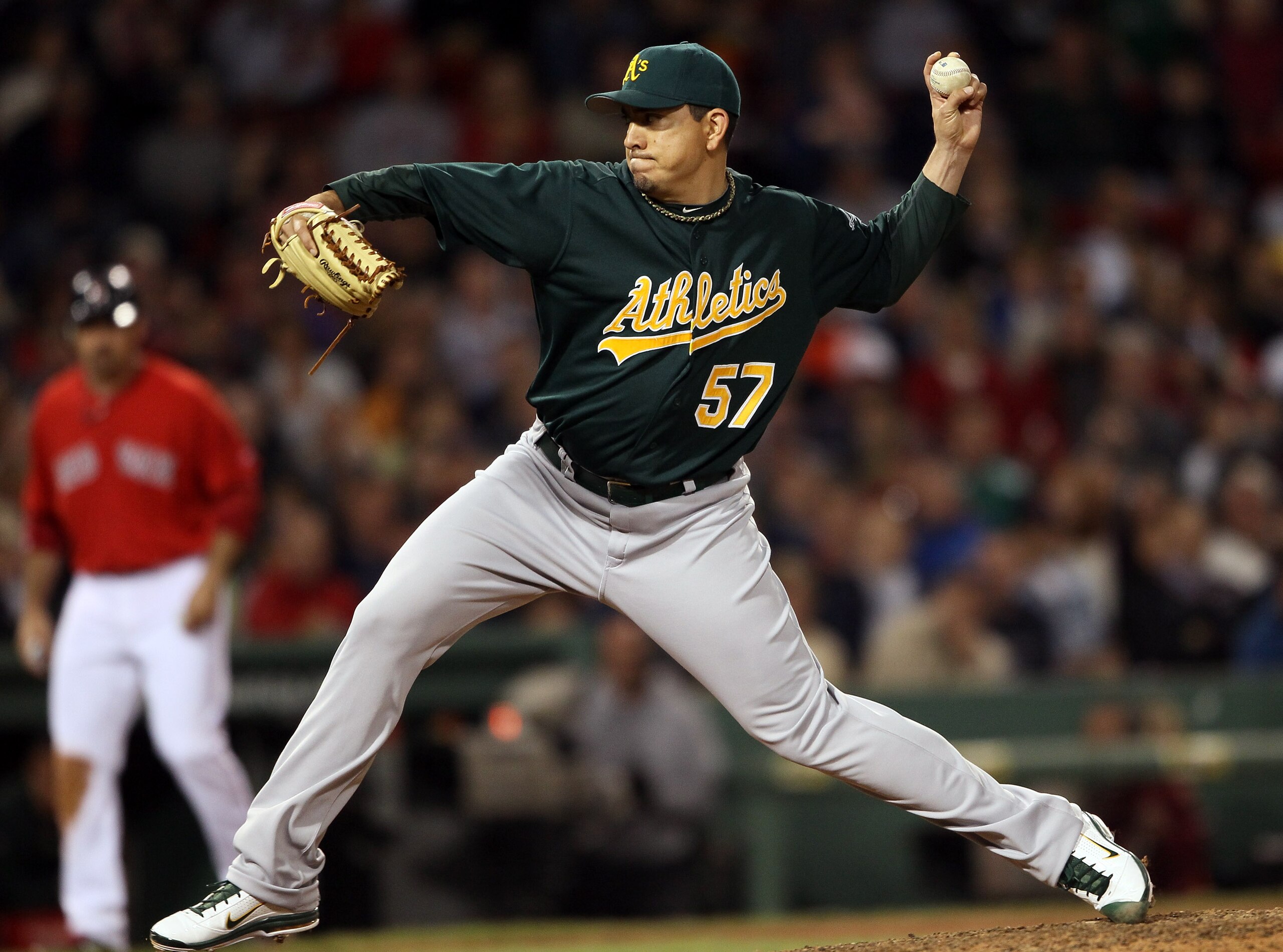 BOSTON, MA - JUNE 03:  Brian Fuentes #57 of the Oakland Athletics delivers a pitch to Carl Crawford of the Boston Red Sox in the seventh inning on June 3, 2011 at Fenway Park in Boston, Massachusetts.  (Photo by Elsa/Getty Images)