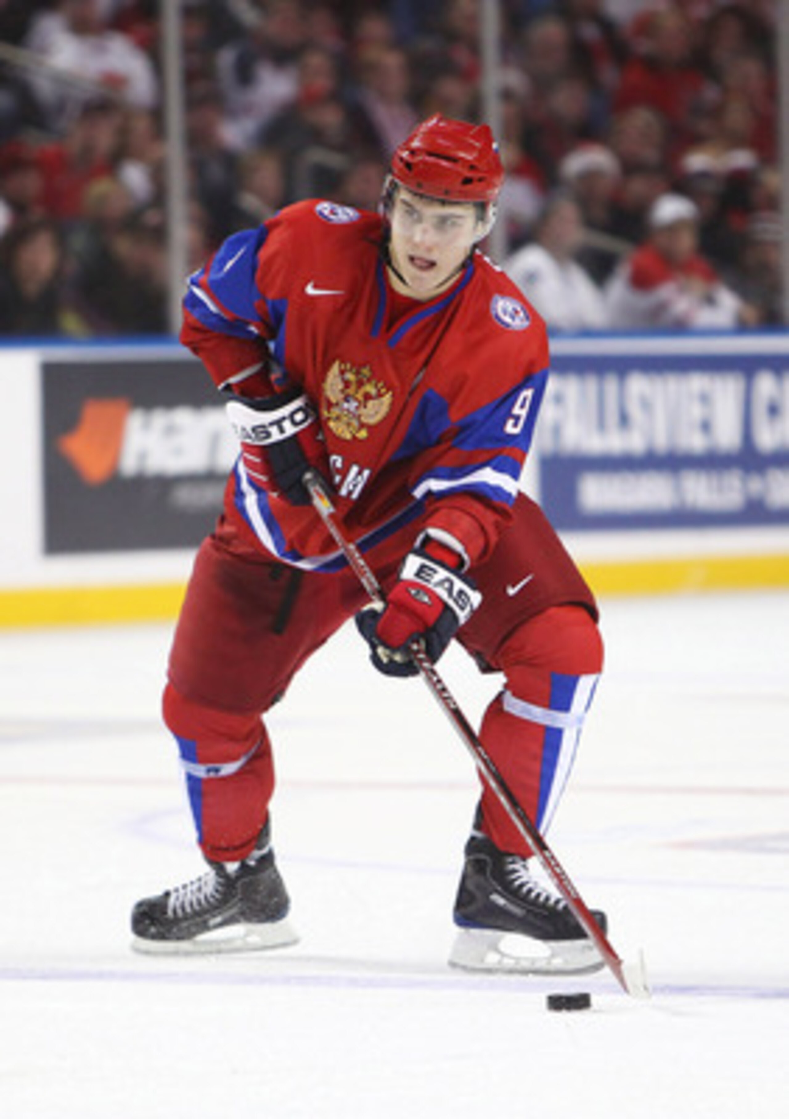 BUFFALO, NY - DECEMBER 26:  Dmitri Orlov #9 of Russia controls the puck during the 2011 IIHF World U20 Championship Group B game between Canada and Russia on December 26, 2010 at HSBC Arena in Buffalo, New York. (Photo by Tom Szczerbowski/Getty Images)