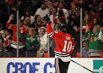 CHICAGO, IL - MARCH 14: Patrick Sharp #10 of the Chicago Blackhawks celebrates a goal scored against the San Jose Sharks at the United Center on March 14, 2011 in Chicago, Illinois. The Blackhawks defeated the Sharks 6-3. (Photo by Jonathan Daniel/Getty I