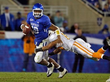LEXINGTON, KY - NOVEMBER 28:  Morgan Newton #12 of the Kentucky Wildcats is tackled by Janzen Jackson #15 of the Tennessee Volunteers during the SEC game at Commonwealth Stadium on November 28, 2009 in Lexington, Kentucky.  (Photo by Andy Lyons/Getty Imag