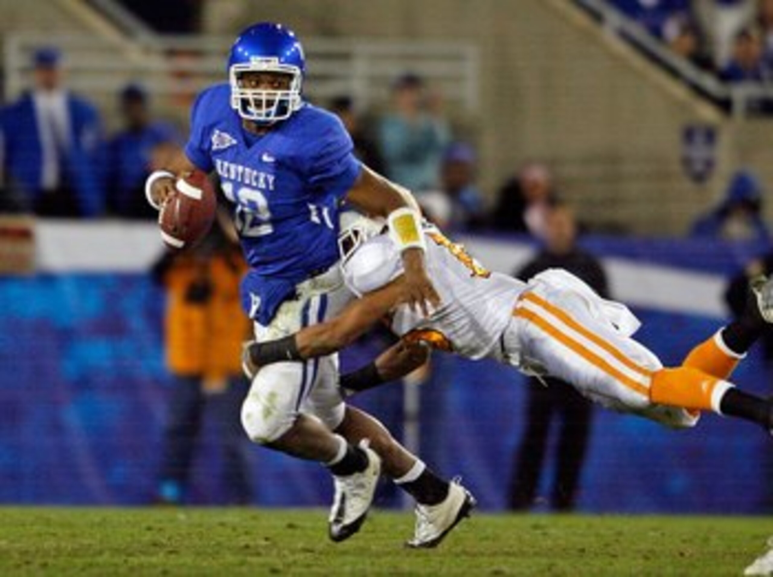 LEXINGTON, KY - NOVEMBER 28:  Morgan Newton #12 of the Kentucky Wildcats is tackled by Janzen Jackson #15 of the Tennessee Volunteers during the SEC game at Commonwealth Stadium on November 28, 2009 in Lexington, Kentucky.  (Photo by Andy Lyons/Getty Imag