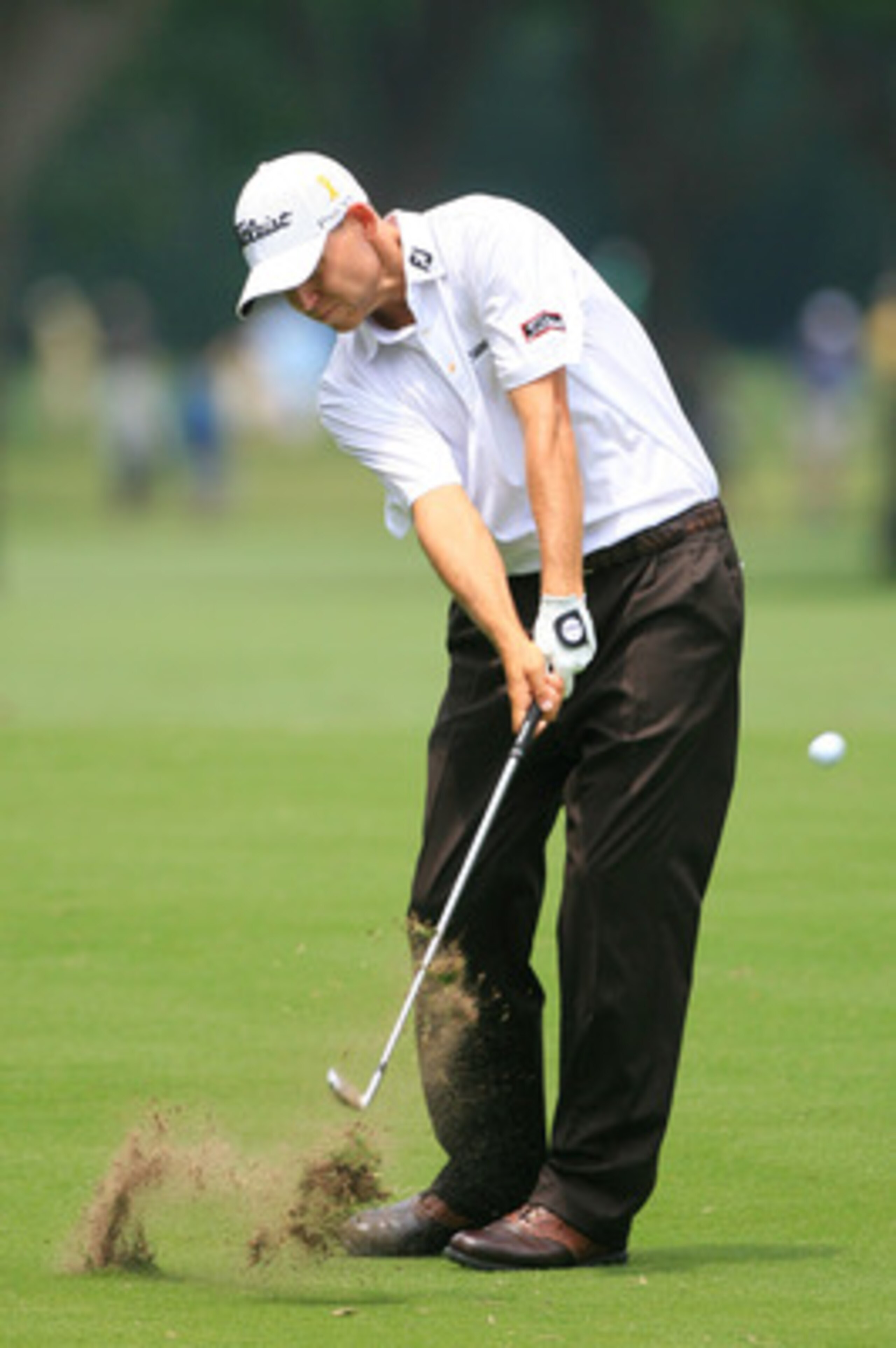 FORT WORTH, TX - MAY 21:  Bill Haas hits a shot during the third round of the Crowne Plaza Invitational at Colonial Country Club on May 21, 2011 in Fort Worth, Texas. (Photo by Hunter Martin/Getty Images)