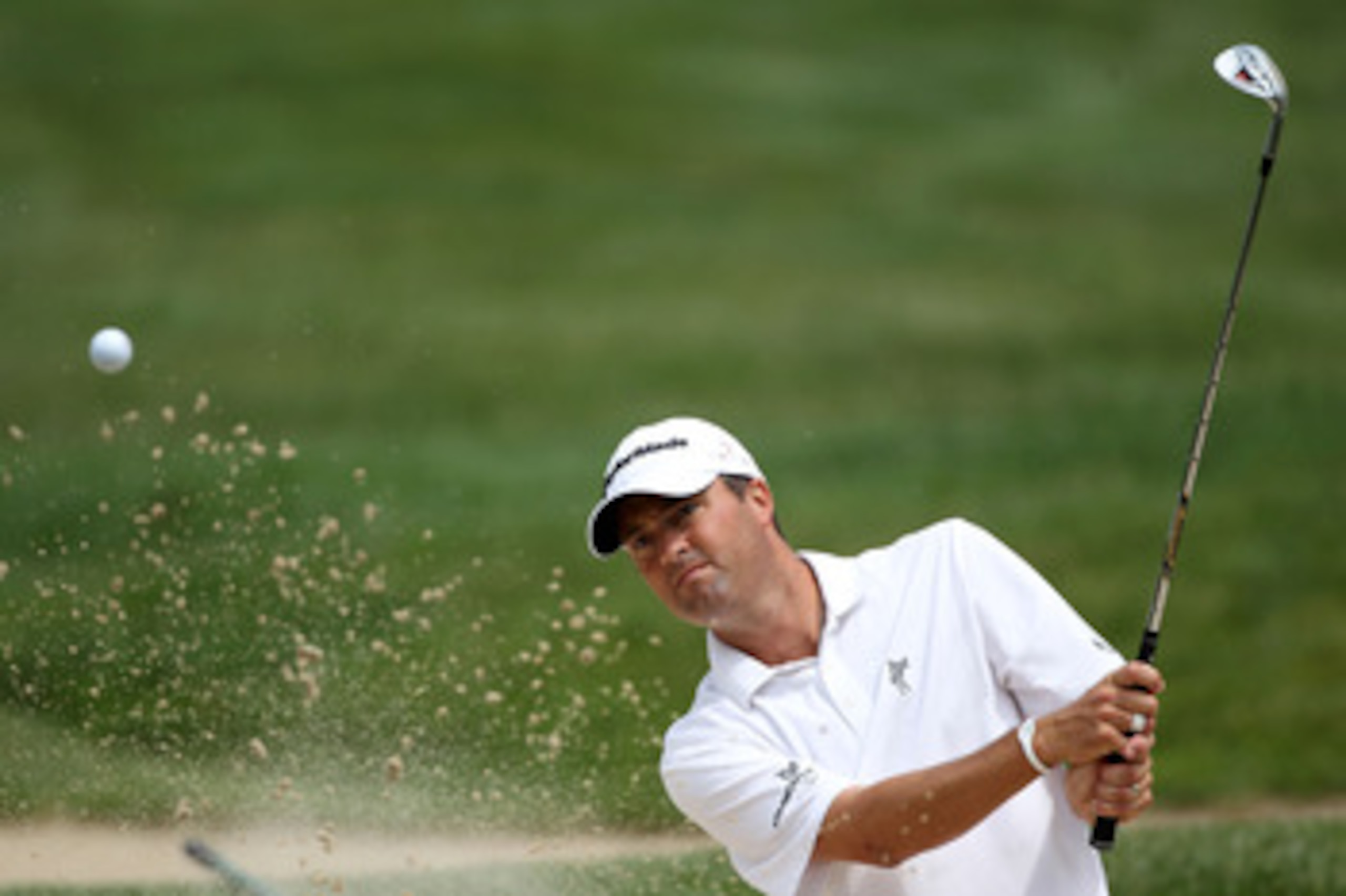 BETHESDA, MD - JUNE 13:  Ryan Palmer plays a bunker shot during a practice round prior to the start of the 111th U.S. Open at Congressional Country Club on June 13, 2011 in Bethesda, Maryland.  (Photo by Andrew Redington/Getty Images)