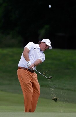 BETHESDA, MD - JUNE 14:  Phil Mickelson hits a shot during a practice round prior to the start of the 111th U.S. Open at Congressional Country Club on June 14, 2011 in Bethesda, Maryland.  (Photo by Rob Carr/Getty Images)