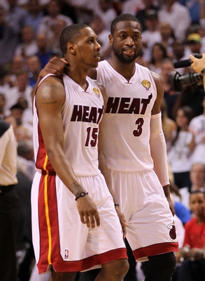 MIAMI, FL - JUNE 12:  (L-R) Mario Chalmers #15 and Dwyane Wade #3 of the Miami Heat talk on court against the Dallas Mavericks in the first half of Game Six of the 2011 NBA Finals at American Airlines Arena on June 12, 2011 in Miami, Florida. NOTE TO USER