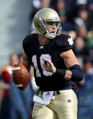 SOUTH BEND, IN - OCTOBER 30: Dayne Crist #10 of the Notre Dame Fighting Irish looks for a receiver against the Tulsa Golden Hurricane at Notre Dame Stadium on October 30, 2010 in South Bend, Indiana. Tulsa defeated Notre Dame 28-27. (Photo by Jonathan Dan