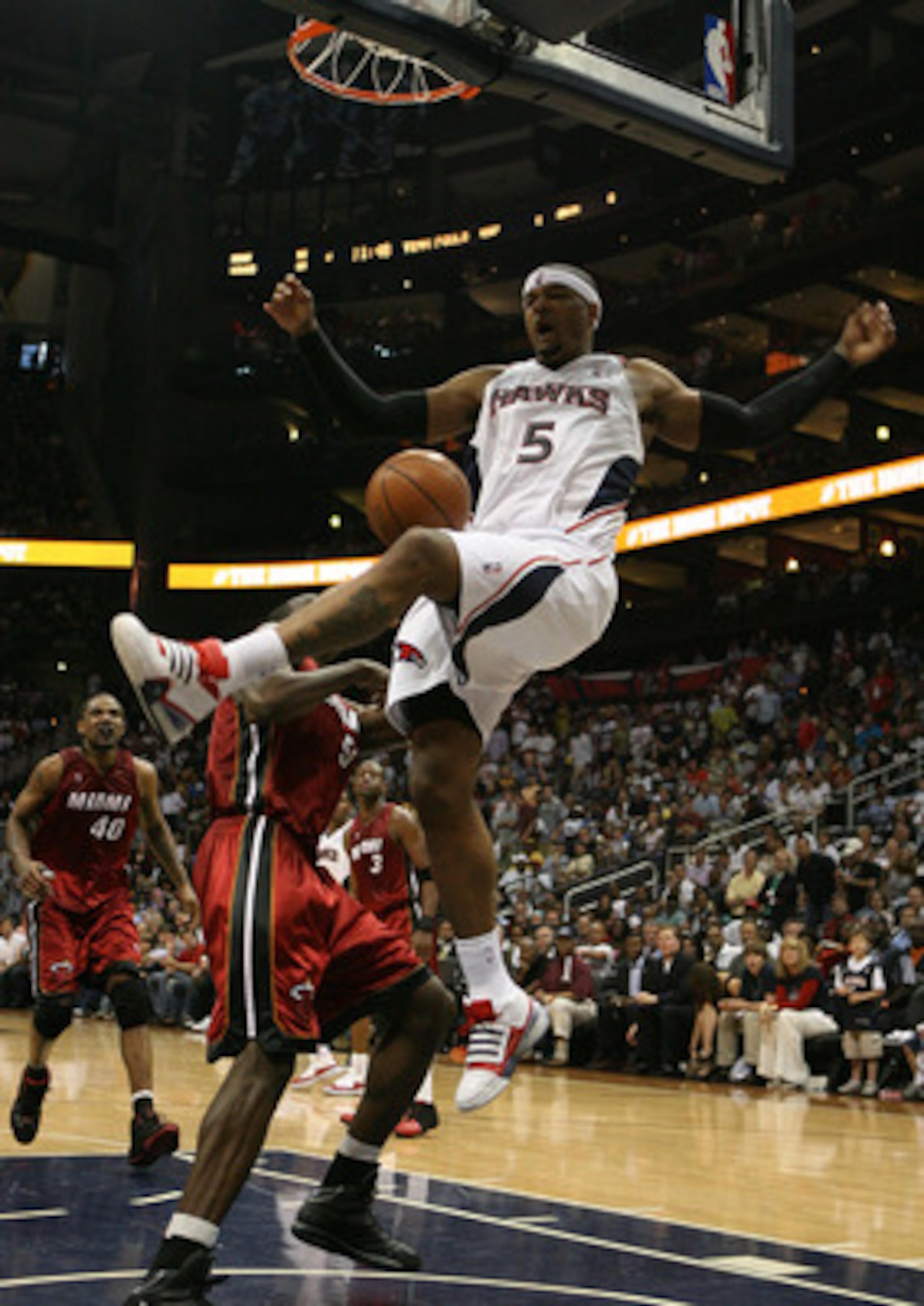 ATLANTA - MAY 03:  Josh Smith #5 of the Atlanta Hawks celebrates celebrates after dunking over Joel Anthony #50 of the Miami Heat during Game Seven of the Eastern Conference Quarterfinals at Philips Arena on May 3, 2009 in Atlanta, Georgia. The Hawks defe