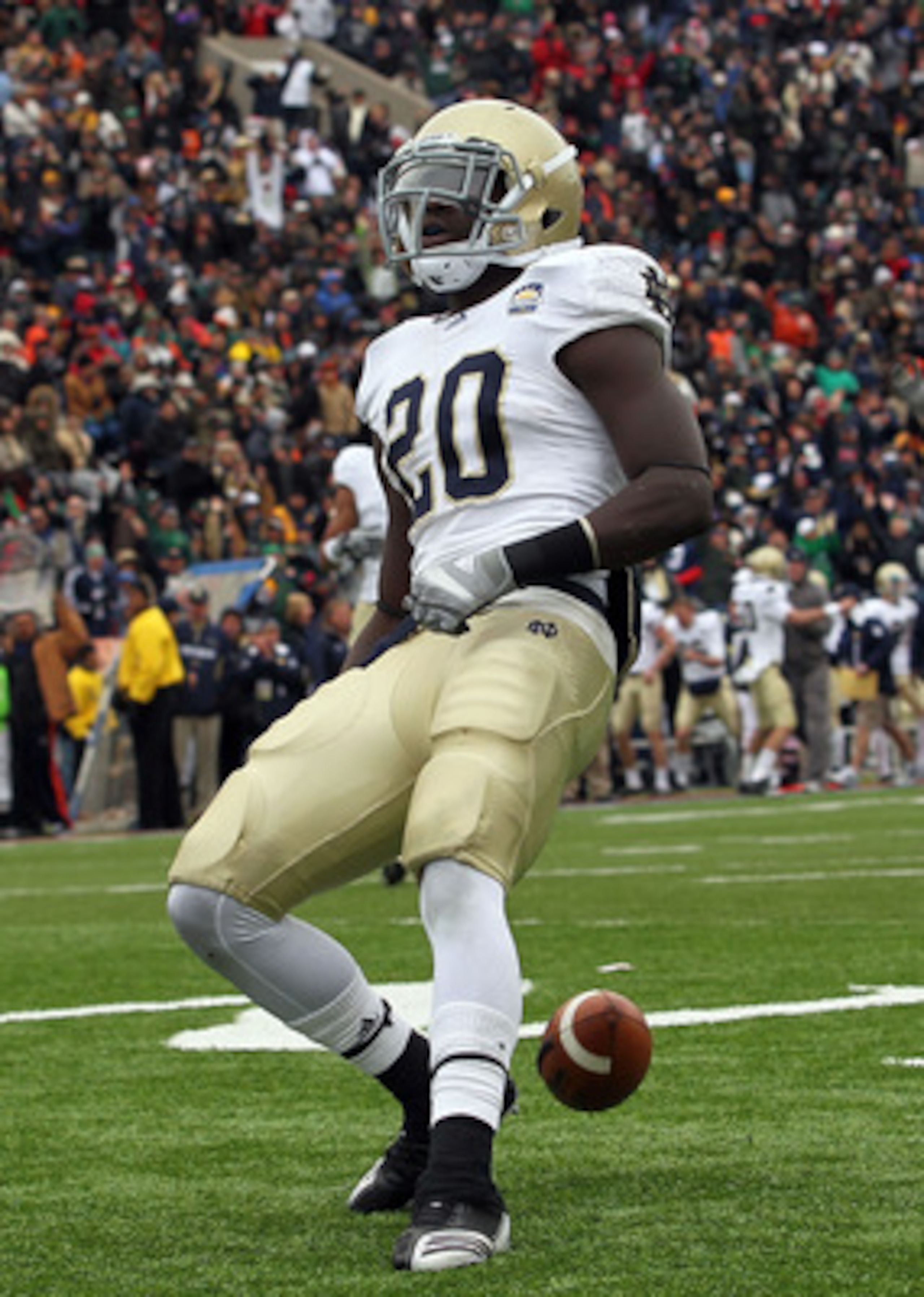 EL PASO, TX - DECEMBER 30:  Running back Cierre Wood #20 of the Notre Dame Fighting Irish celebrates a touchdown against the Miami Hurricanes during the Hyundai Sun Bowl at Sun Bowl on December 30, 2010 in El Paso, Texas.  (Photo by Ronald Martinez/Getty 