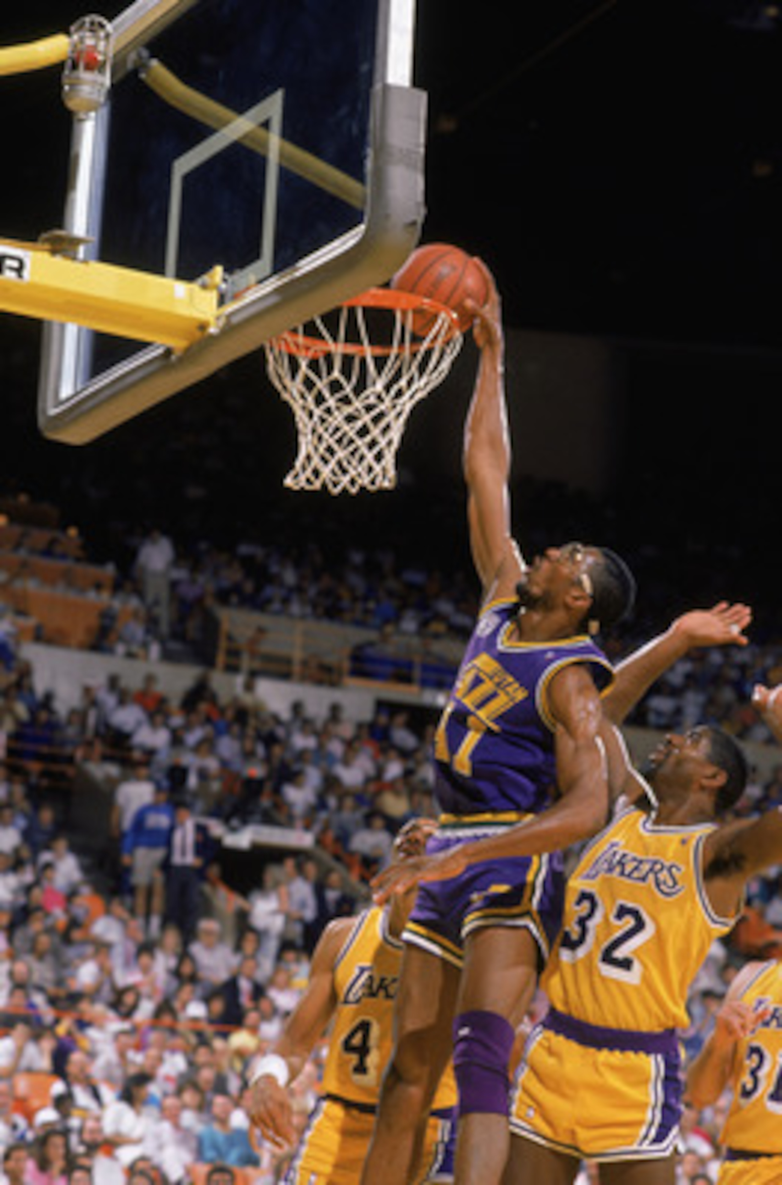 SALT LAKE CITY - 1988:  Thurl Bailey #41 of the Utah Jazz dunks the ball during an NBA game at The Salt Palace in Salt Lake City, Utah in 1988. (Photo by Stephen Dunn/Getty Images)