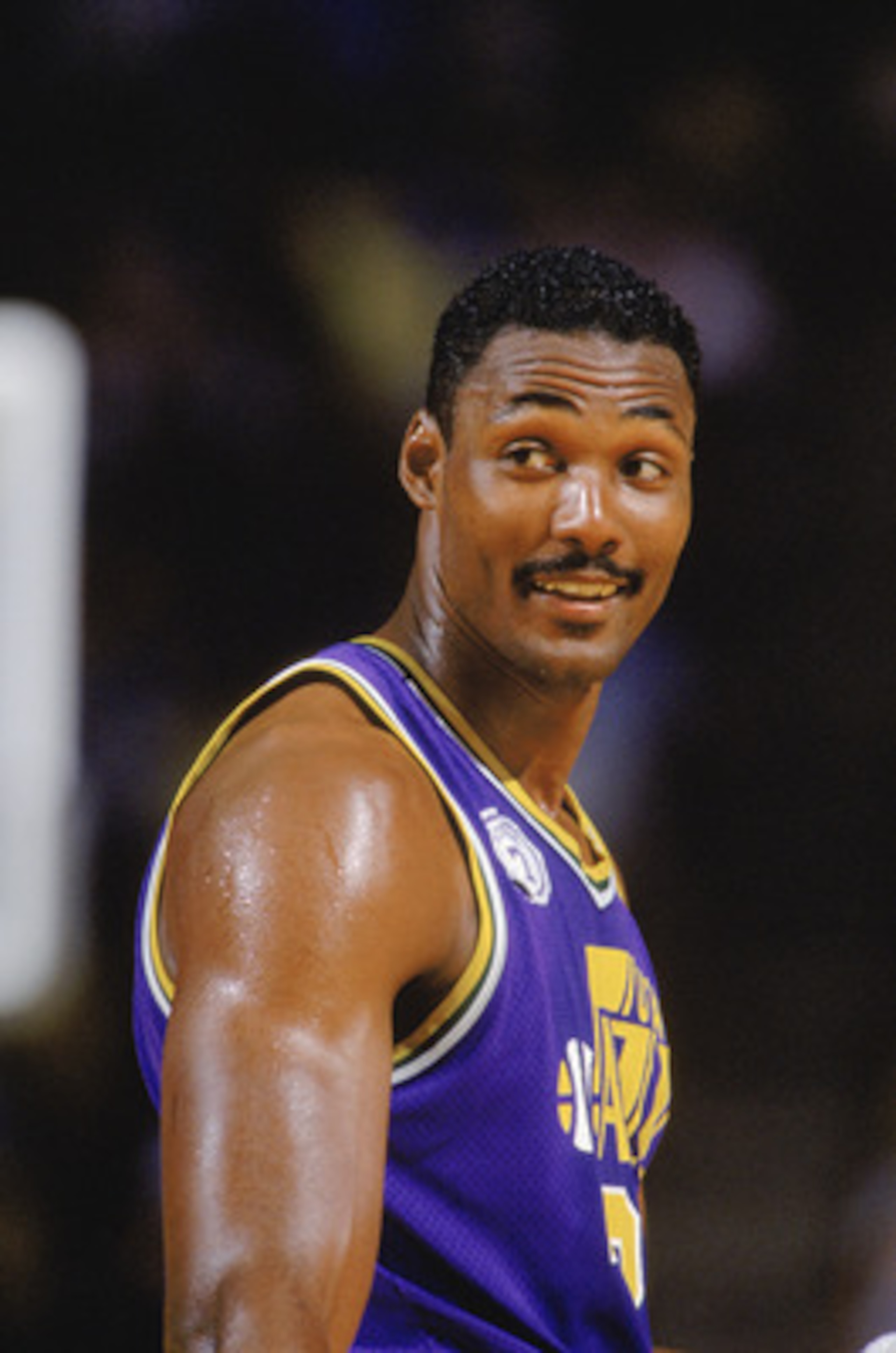 SALT LAKE CITY - 1989:  Karl Malone #32 of the Utah Jazz smiles during an NBA game at The Salt Palace in Salt Lake City, Utah in 1989. (Photo by Rick Stewart/Getty Images)