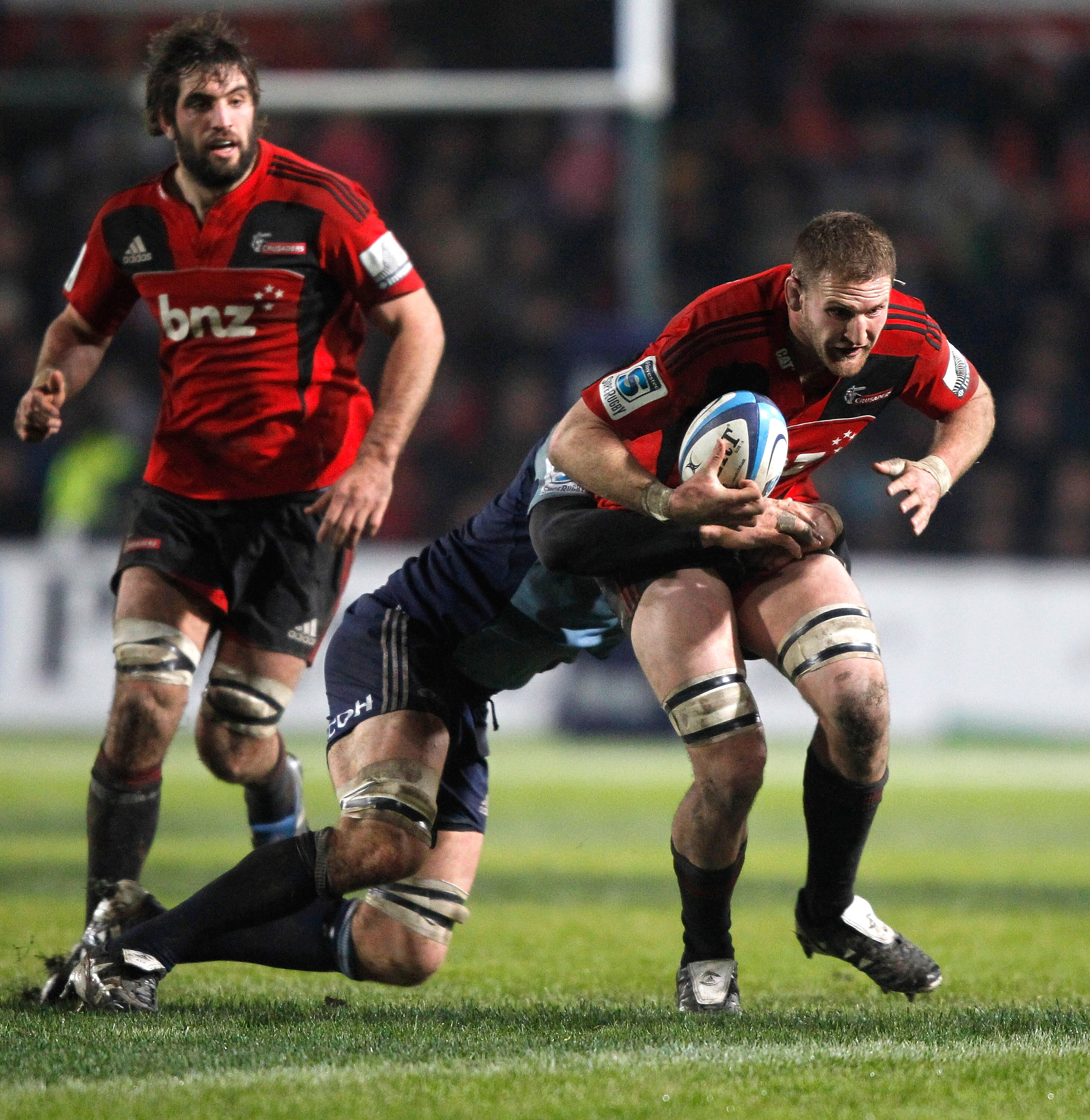 CHRISTCHURCH, NEW ZEALAND - JUNE 11: Kieran Read of the Crusaders is tackled during the round 17 Super Rugby match between the Crusaders and the Blues at Alpine Energy Stadium on June 11, 2011 in Christchurch, New Zealand. (Photo by Martin Hunter/Getty I CHRISTCHURCH, NEW ZEALAND - JUNE 11: Kieran Read of the Crusaders is tackled during the round 17 Super Rugby match between the Crusaders and the Blues at Alpine Energy Stadium on June 11, 2011 in Christchurch, New Zealand. (Photo by Martin Hunter/Getty I