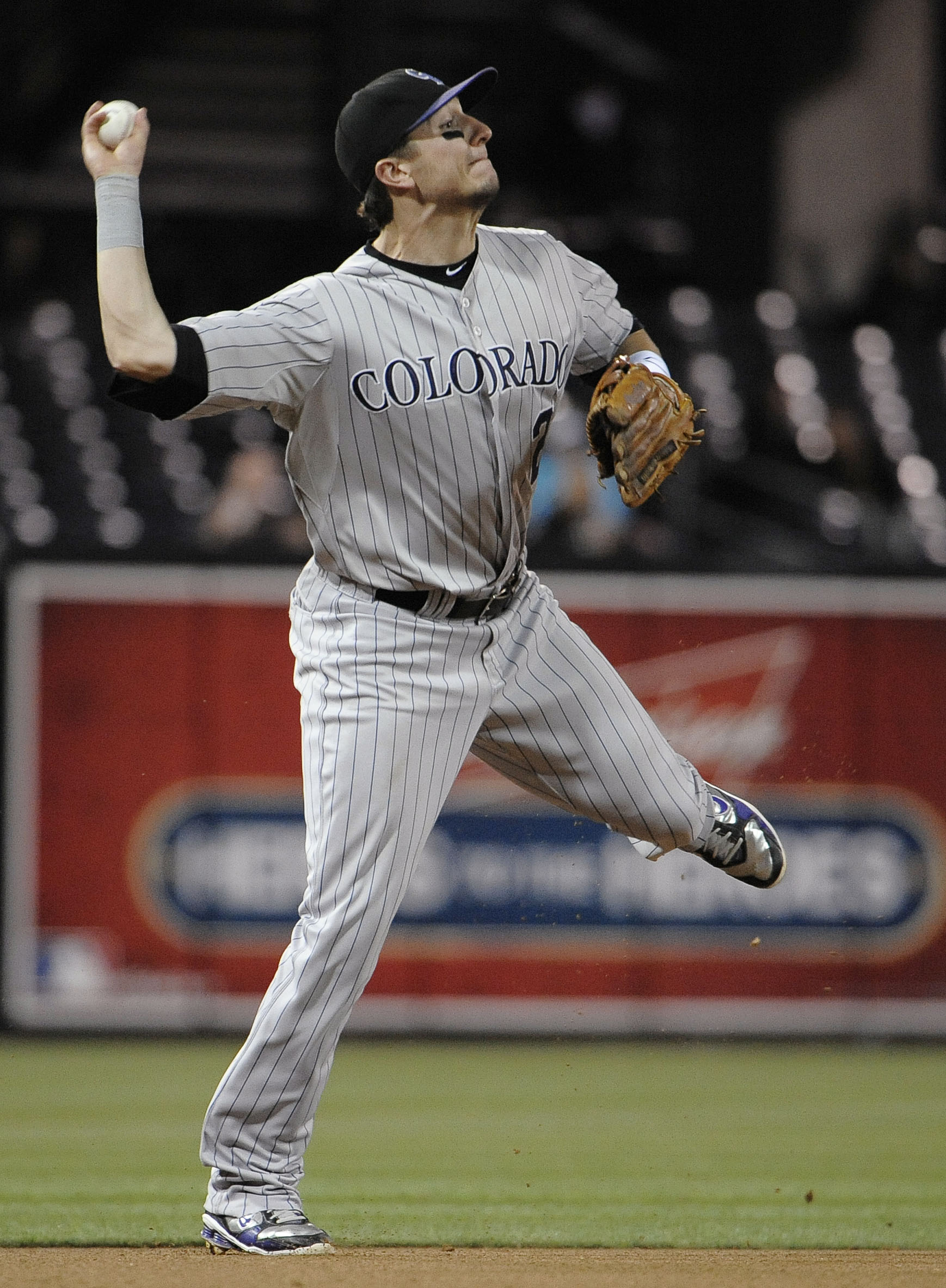 SAN DIEGO, CA - JUNE 6: Troy Tulowitzki #2 of the Colorado Rockies throws to first on ground ball hit by Jorge Cantu #3 of the San Diego Padres during the sixth inning of a baseball game Petco Park on June 6, 2011 in San Diego, California.  Tulowitzki got