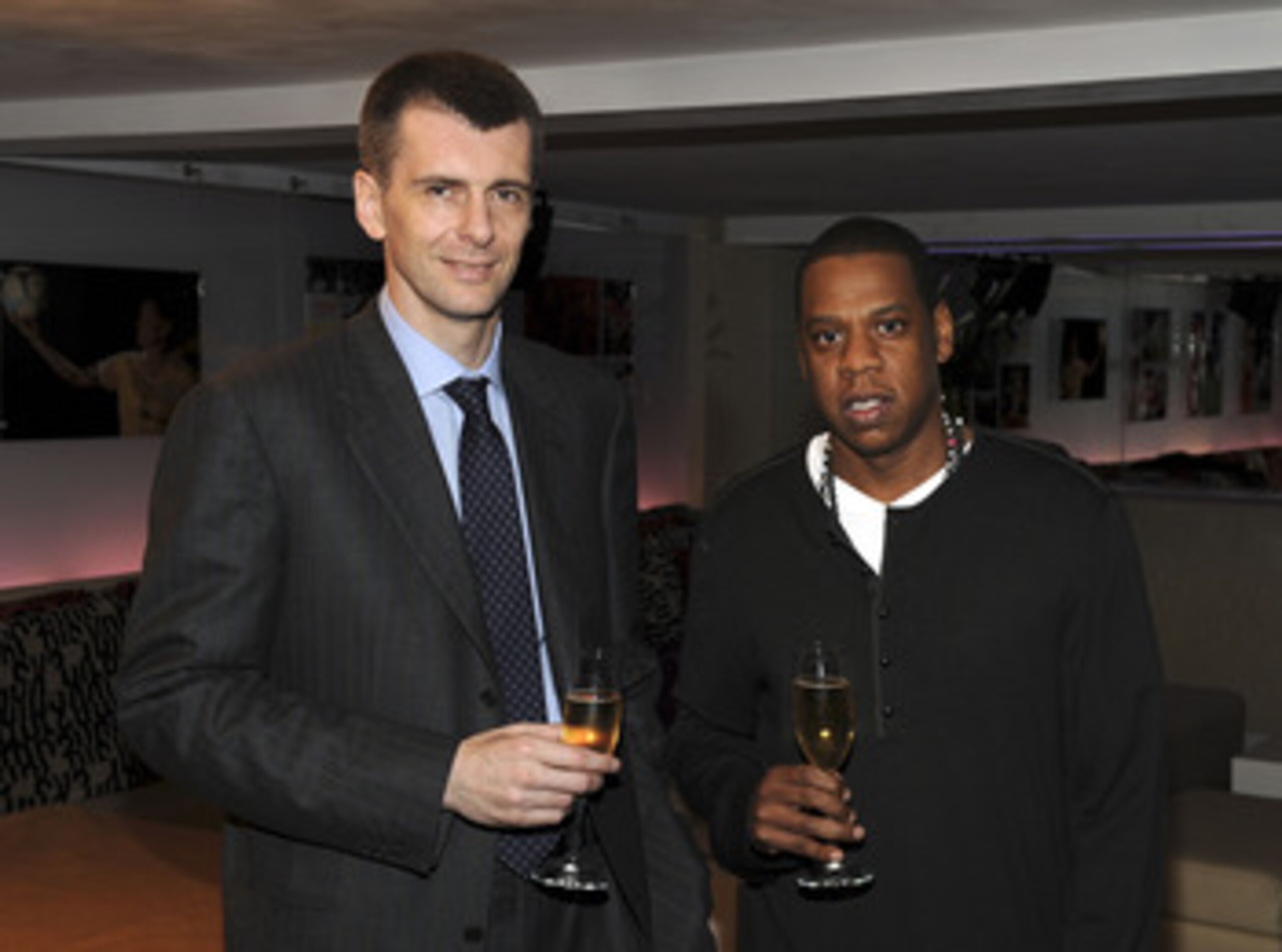 NEW YORK - MAY 18:  (EXCLUSIVE) Nets owner Mikhail Prokhorov with cultural icon and Nets investor JAY-Z celebrate Prokhorov's purchase of the team at lunch today at JAY-Z's 40/40 club on May 18, 2010 in New York City. Prokhorov is representing the Nets to