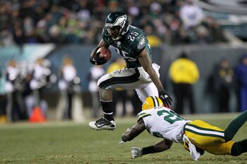 PHILADELPHIA, PA - JANUARY 09:  LeSean McCoy #25 of the Philadelphia Eagles avoids the tackle of Charlie Peprah #26 of the Green Bay Packers during the 2011 NFC wild card playoff game at Lincoln Financial Field on January 9, 2011 in Philadelphia, Pennsylv