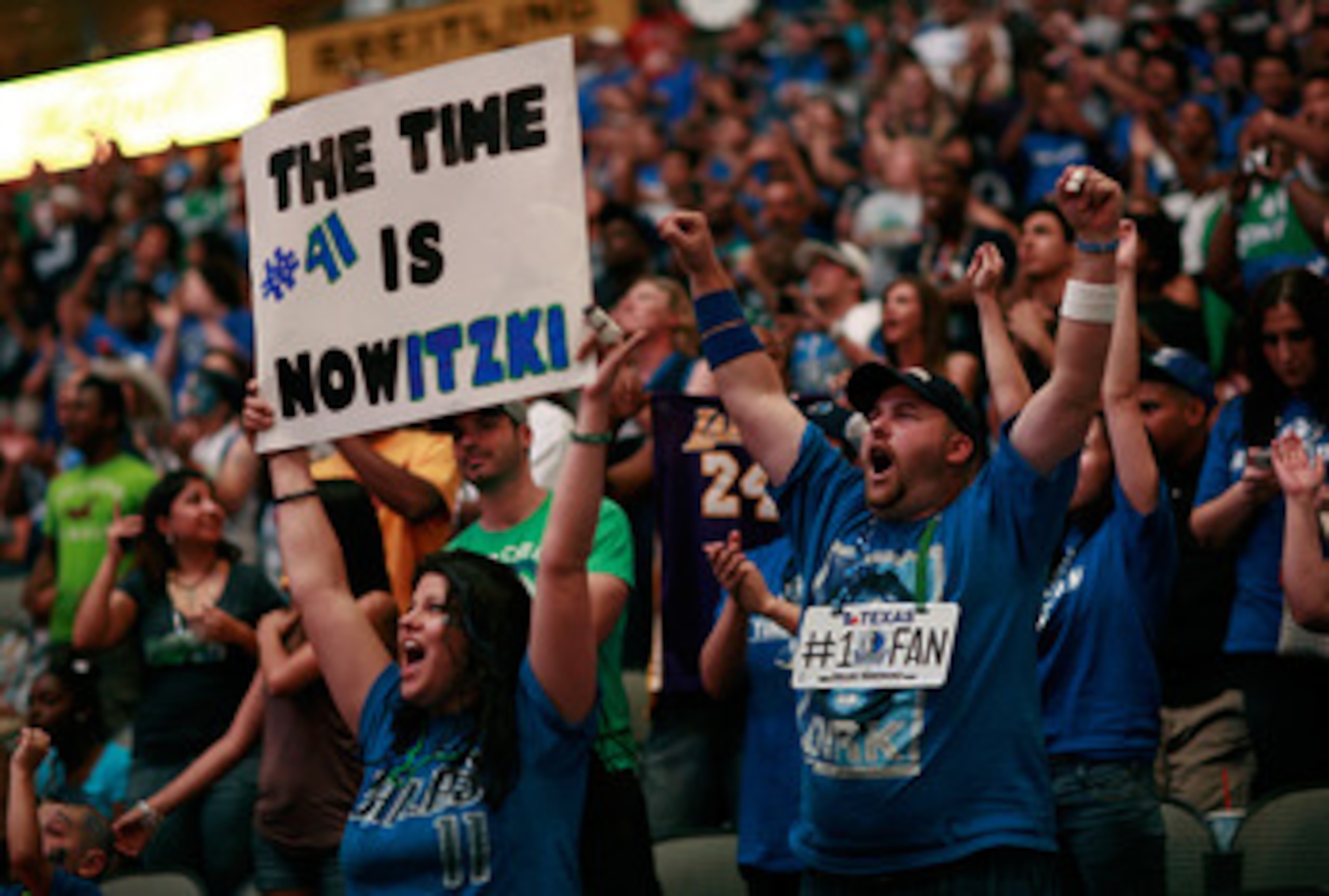 DALLAS, TX - JUNE 12:  Dallas Mavericks fans cheer on the Mavericks from American Airlines Center during the NBA Finals watch party on June 12, 2011 in Dallas, Texas. NOTE TO USER: User expressly acknowledges and agrees that, by downloading and/or using t