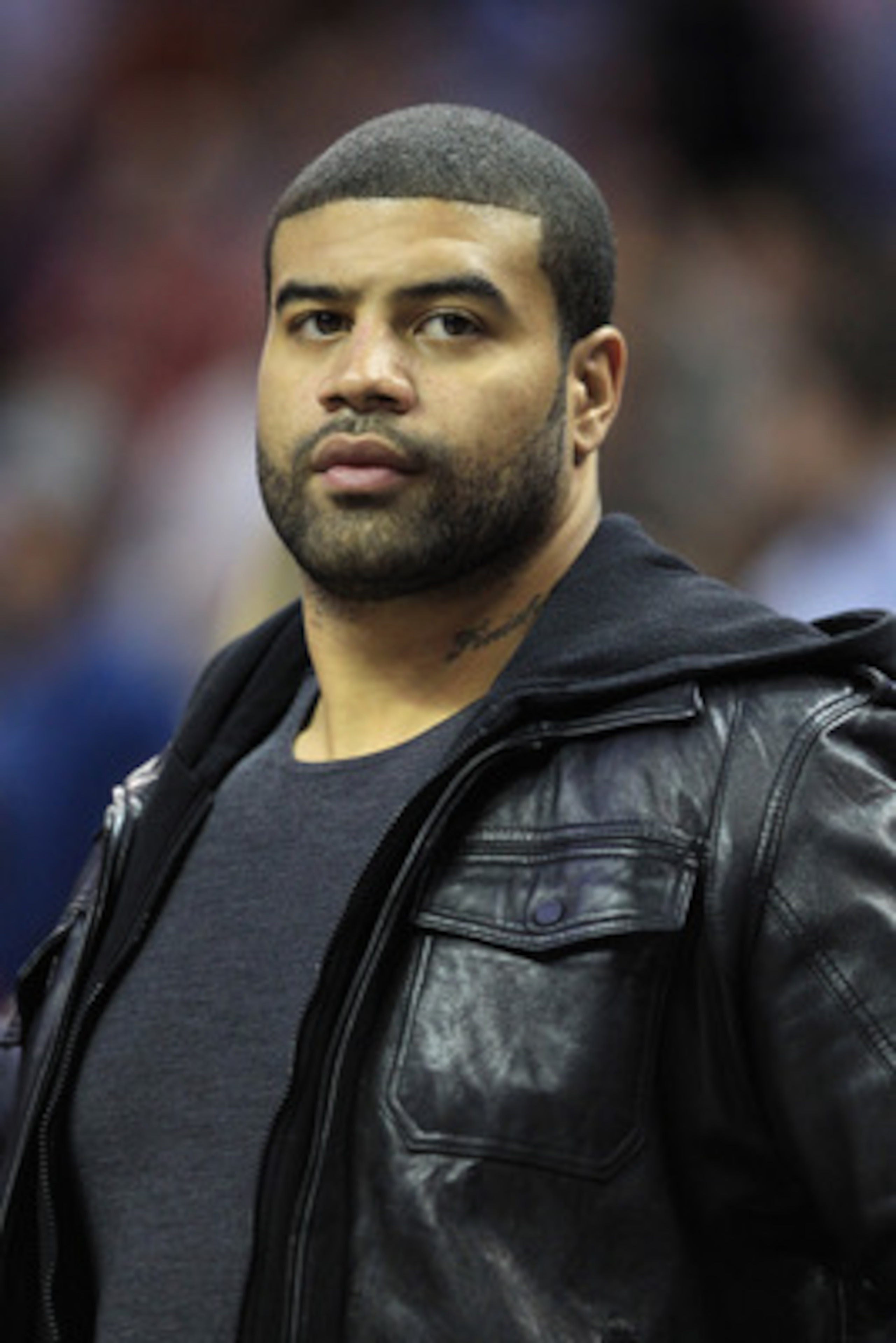CHARLOTTE, NC - FEBRUARY 14: Shawne Merriman of the Buffalo Bills watches on during the game between the Los Angeles Lakers and Charlotte Bobcats at Time Warner Cable Arena on February 14, 2011 in Charlotte, North Carolina. NOTE TO USER: User expressly a CHARLOTTE, NC - FEBRUARY 14: Shawne Merriman of the Buffalo Bills watches on during the game between the Los Angeles Lakers and Charlotte Bobcats at Time Warner Cable Arena on February 14, 2011 in Charlotte, North Carolina. NOTE TO USER: User expressly a