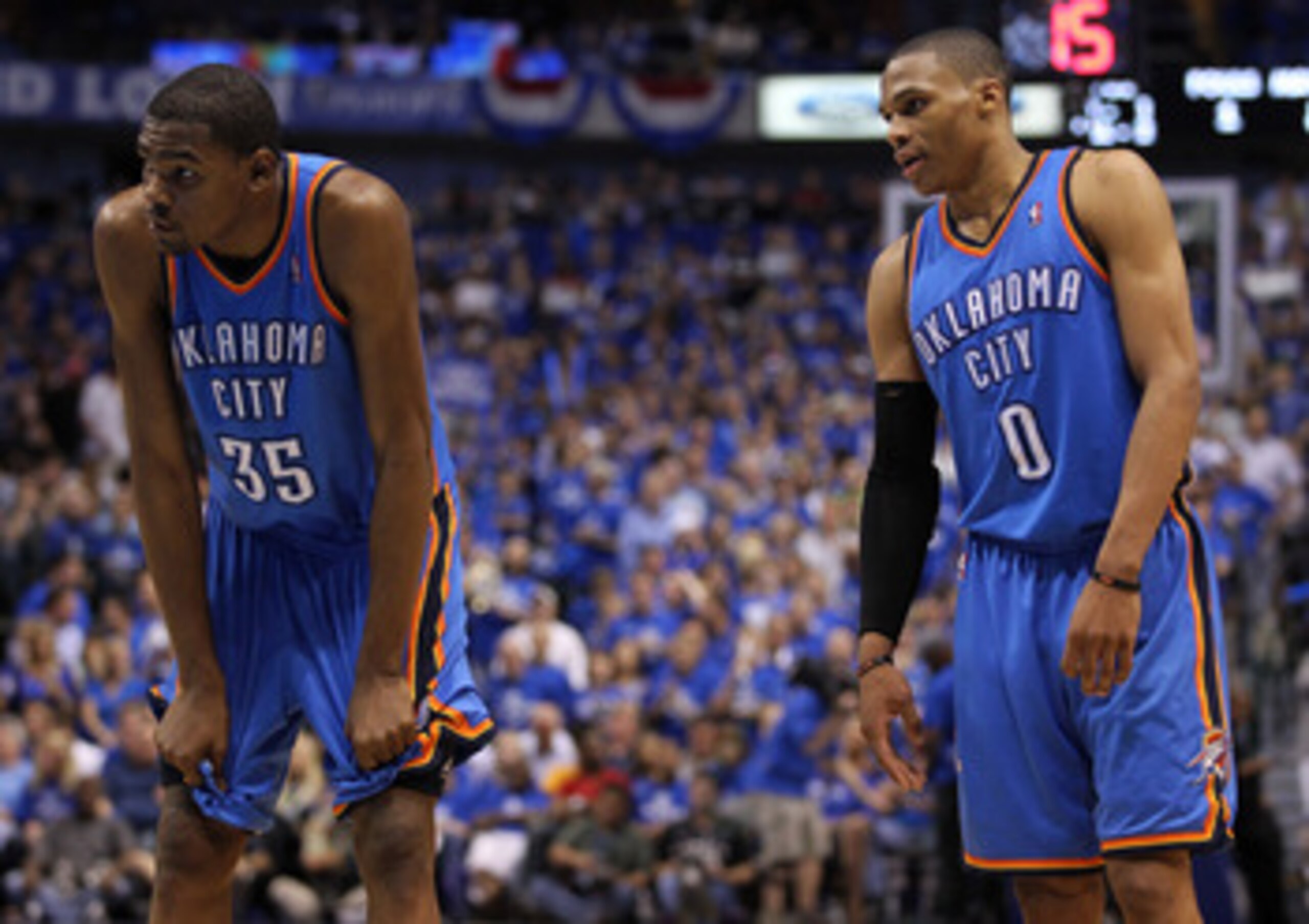 DALLAS, TX - MAY 25:  Kevin Durant #35 and Russell Westbrook #0 of the Oklahoma City Thunder stand next to each other on the court in the fourth quarter while taking on the Dallas Mavericks in Game Five of the Western Conference Finals during the 2011 NBA