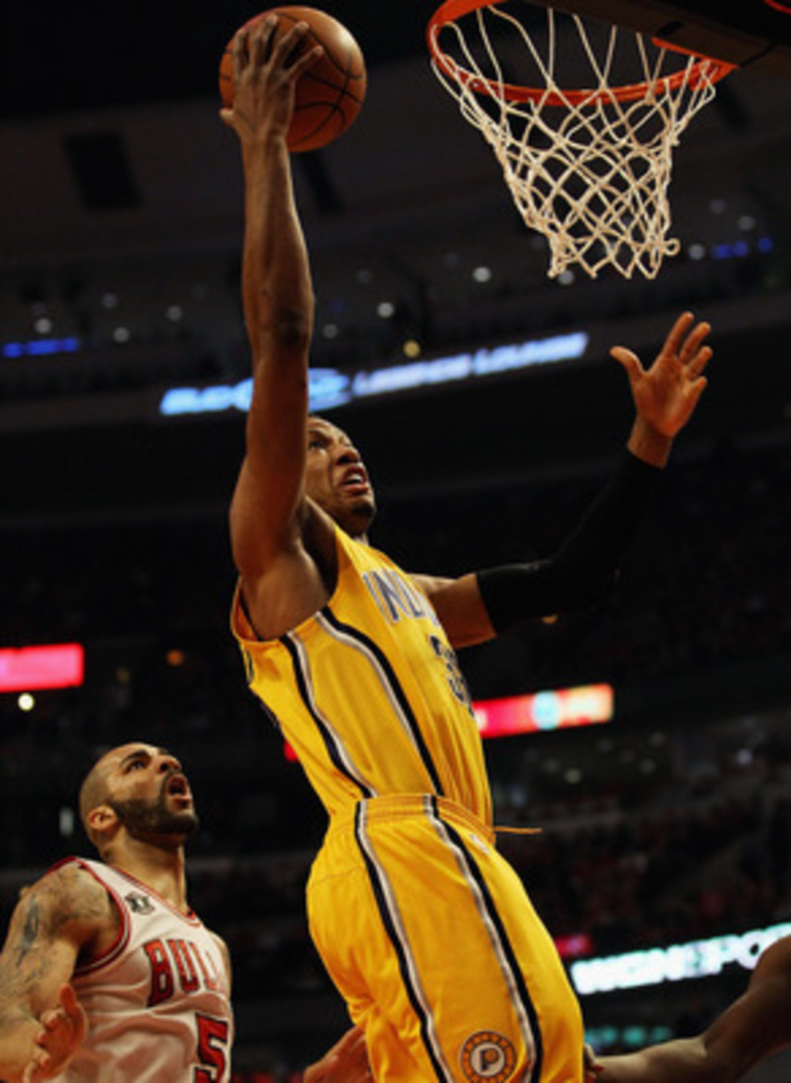CHICAGO, IL - APRIL 26: Danny Granger #33 of the Indiana Pacers drives to the basket past Carlos Boozer #5 of the Chicago Bulls in Game Five of the Eastern Conference Quarterfinals in the 2011 NBA Playoffs at the United Center on April 26, 2011 in Chicago
