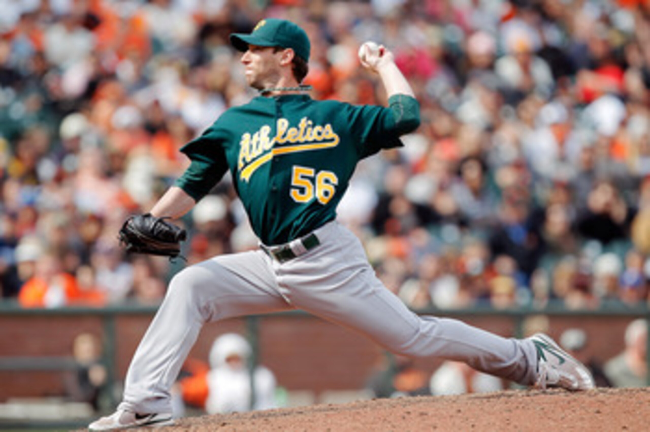 SAN FRANCISCO, CA - MAY 22:  Craig Breslow #56 of the Oakland A's throws in relief against the San Francisco Giants at AT&T Park on May 22, 2011 in San Francisco, California.  The Giants won 5-4.  (Photo by Brian Bahr/Getty Images)
