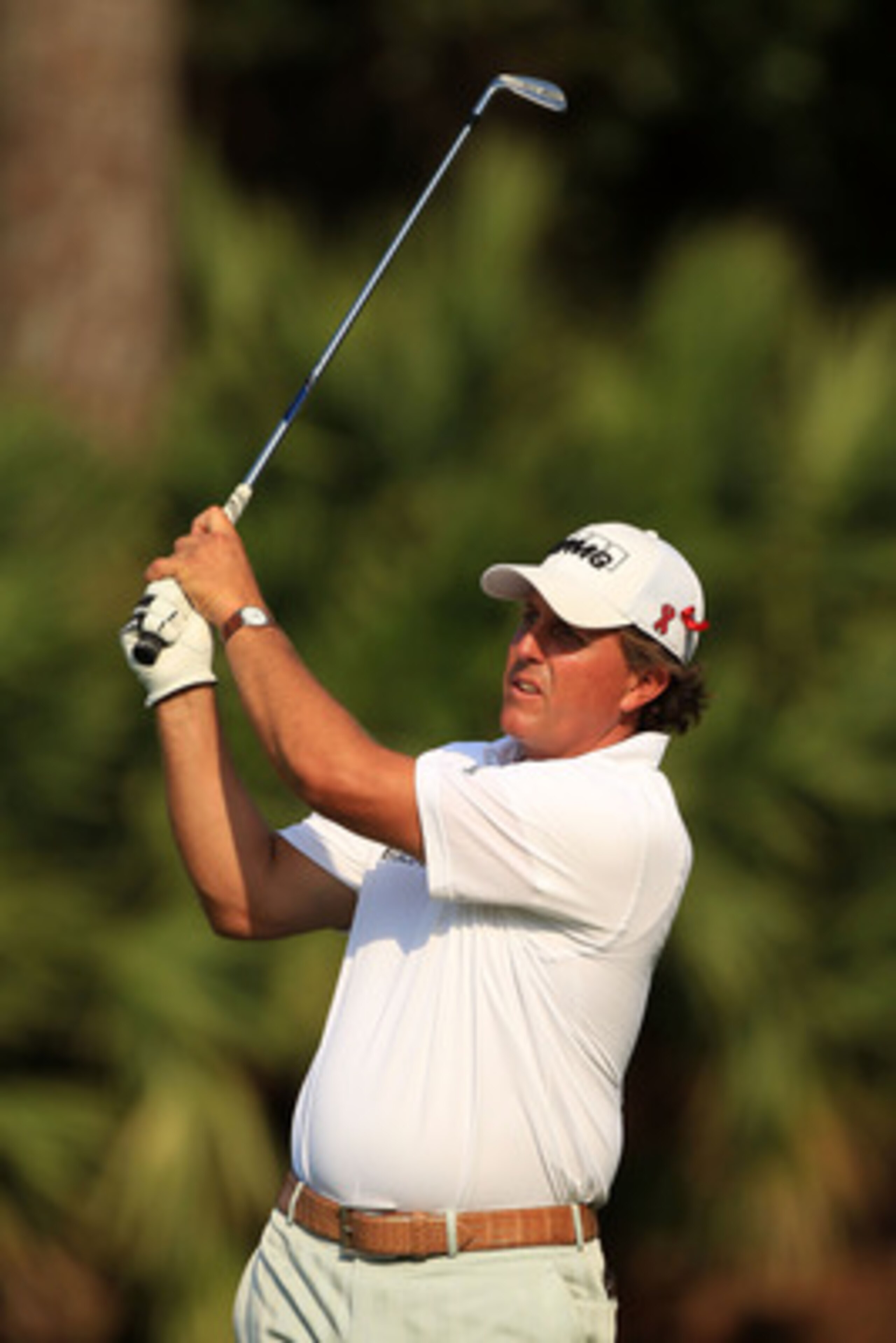 PONTE VEDRA BEACH, FL - MAY 12:  Phil Mickelson hits his tee shot on the 15th hole during the first round of THE PLAYERS Championship held at THE PLAYERS Stadium course at TPC Sawgrass on May 12, 2011 in Ponte Vedra Beach, Florida.  (Photo by Streeter Lec